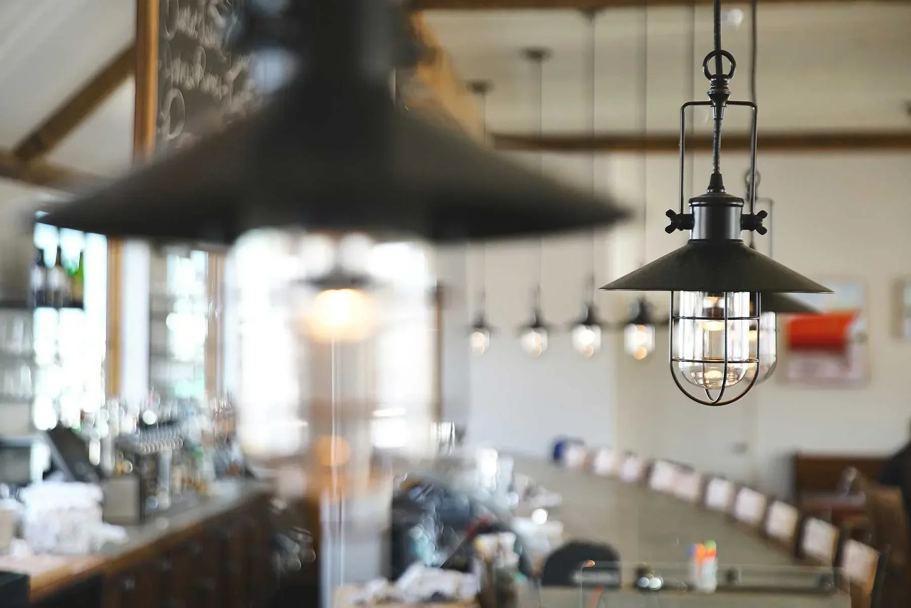 Interior of Scales Restaurant showing industrial lighting and bar design reflecting waterfront setting.