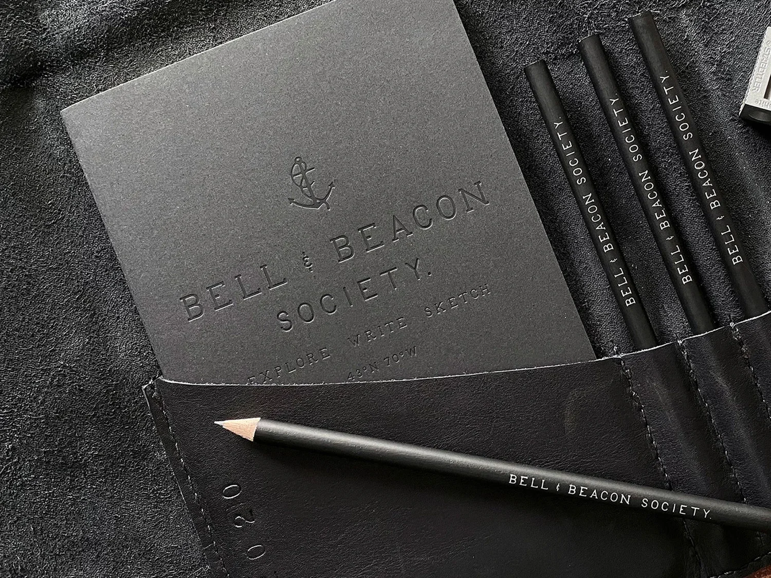 Bell & Beacon brand identity featuring embossed stationery and handcrafted materials rooted in Maine coastal craft.
