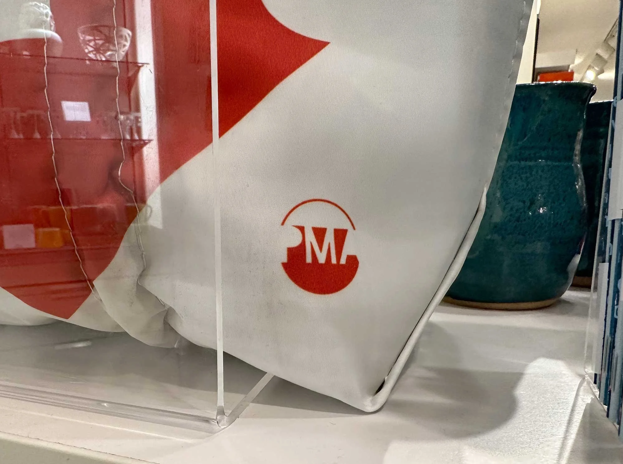 Close-up of museum store tote bag featuring the Portland Museum of Art visual identity