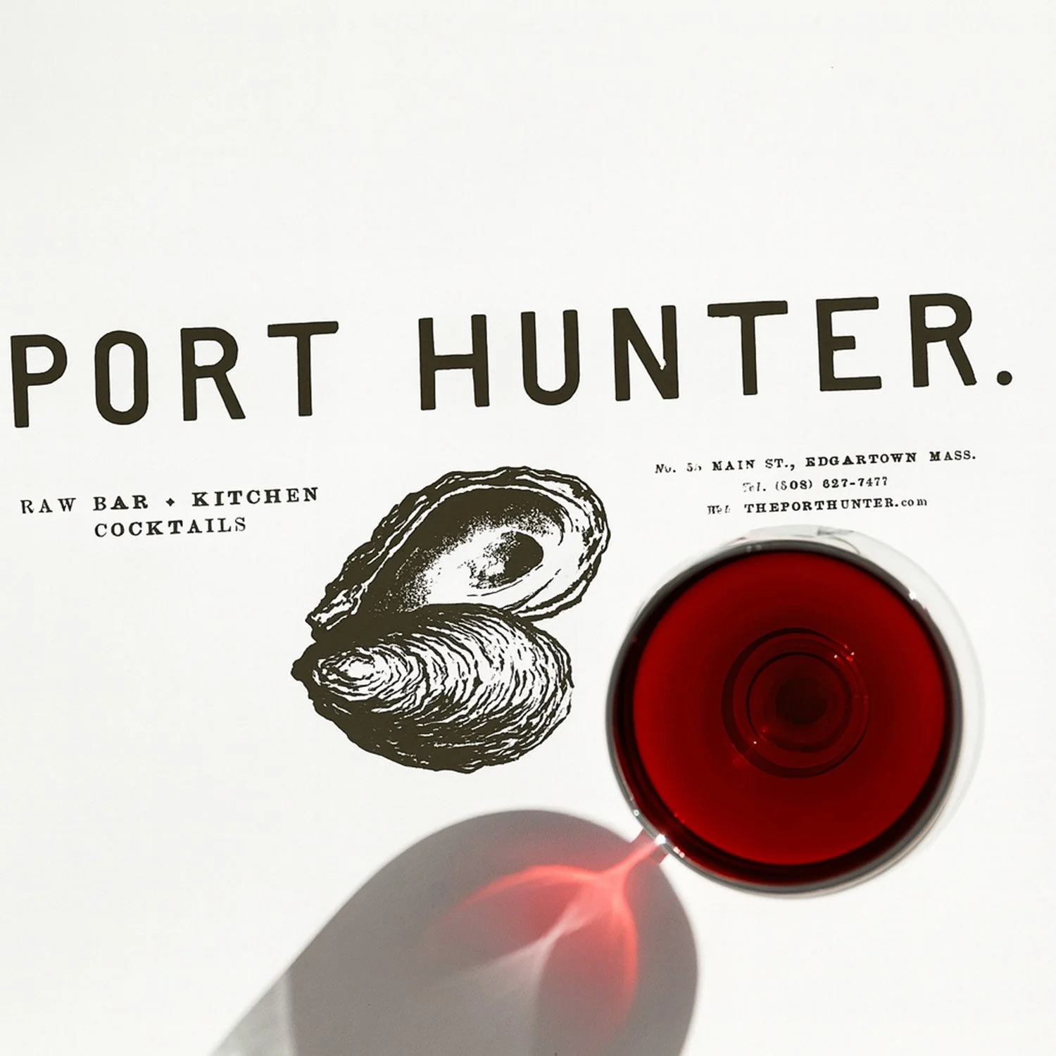 Port Hunter restaurant visual identity featuring custom oyster illustration, distinctive typography, and printed brand materials for Edgartown, Massachusetts.
