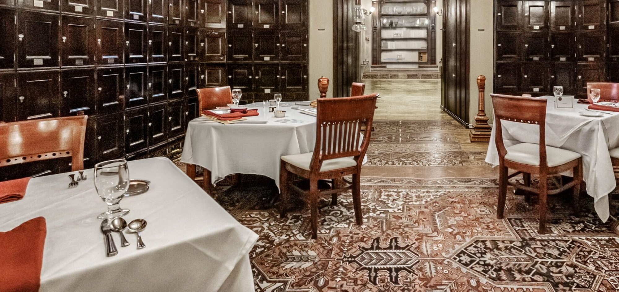 Interior dining room at Cumberland Club with historic architecture and table settings