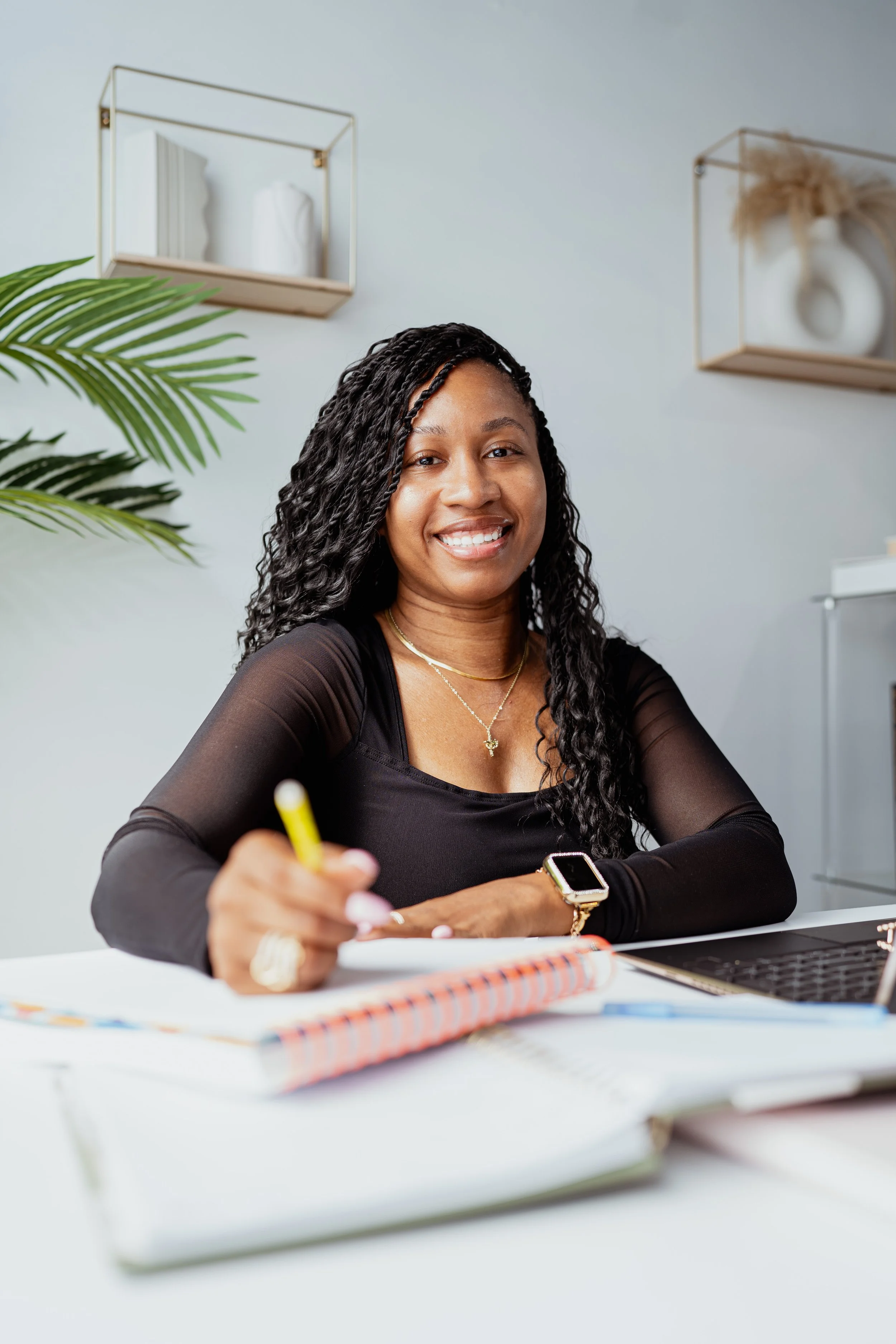 Charity Mahone, Black woman web designer and digital strategist, posing in her Atlanta studio