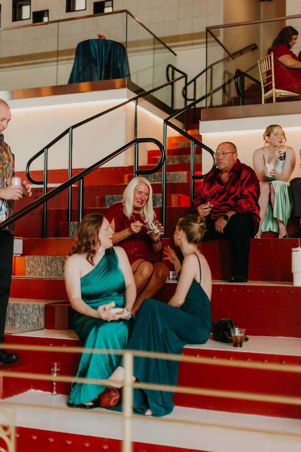 wedding-guests-cocktail-hour-red-stairs-hollywood-theater by stacy bengs.JPG
