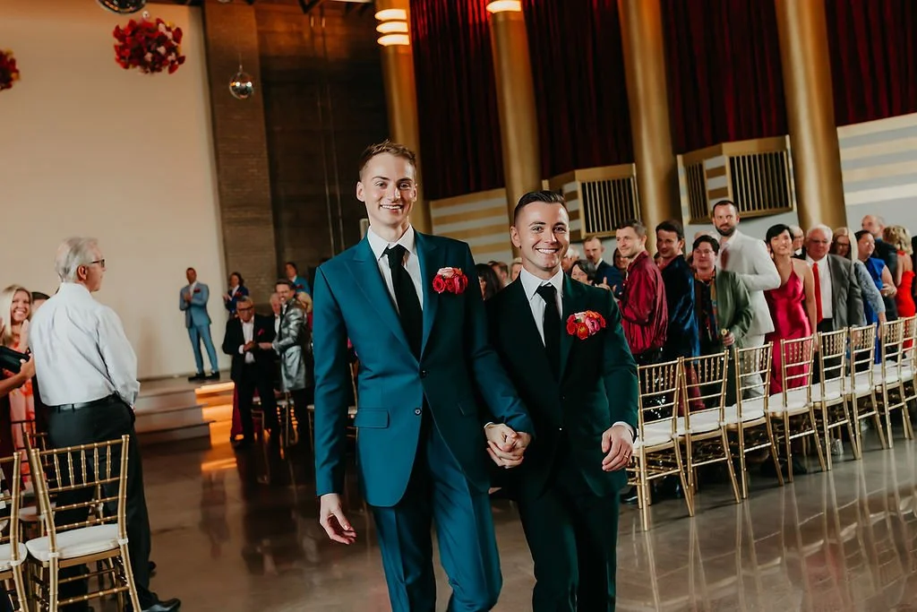 newlywed-grooms-recessional-hollywood-theater-mn by Stacy Bengs.JPG