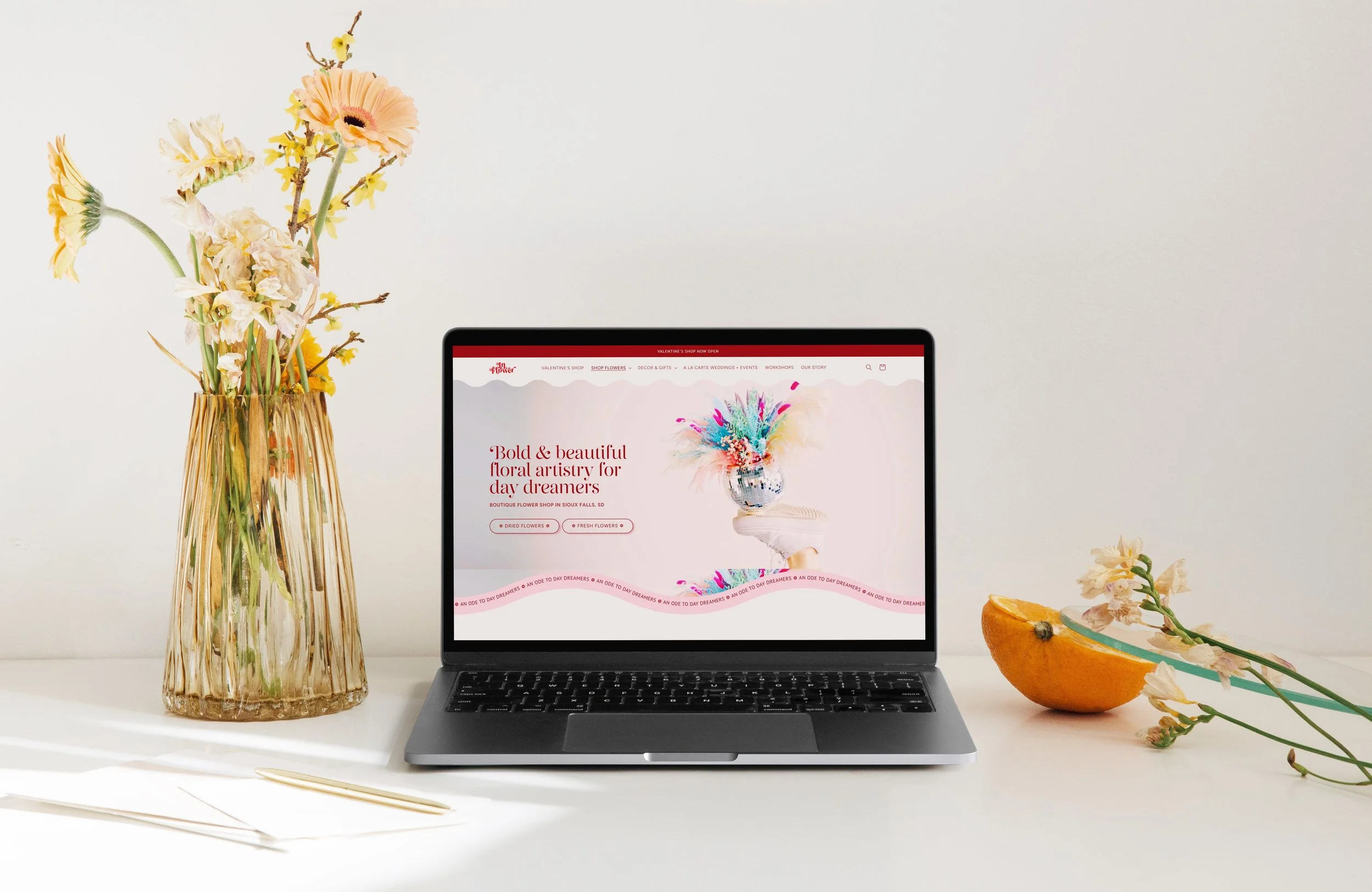 Laptop showing  Shopify website design for Inflower, flower store. Website designed & developed by Brand Unpuzzled.
