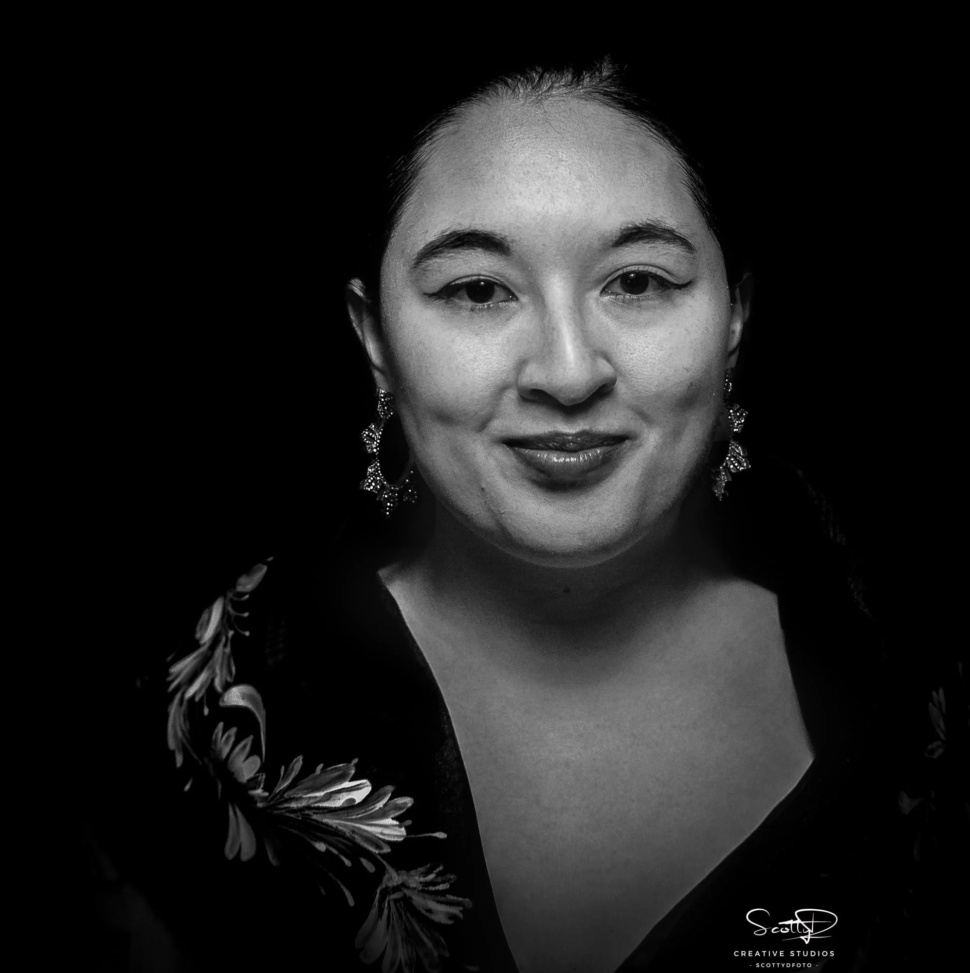 Professional black and white commercial portrait by ScottyD, Dayton Ohio photographer, using invisible black background technique for clean, high-impact branding images.