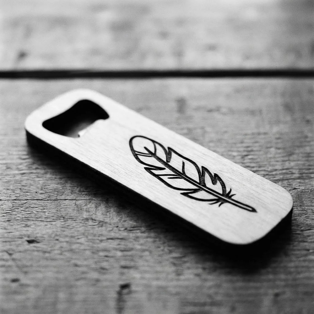 A wooden phone case with a black leaf design lying on a wooden surface.