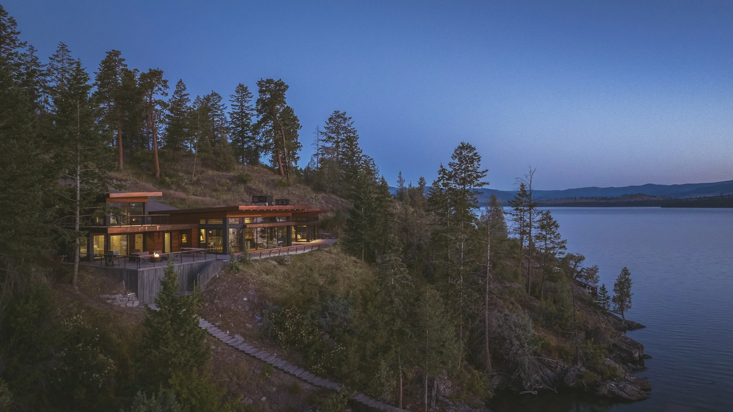 High-end architectural photography of modern residential exterior on Flathead Lake. Polson, Montana