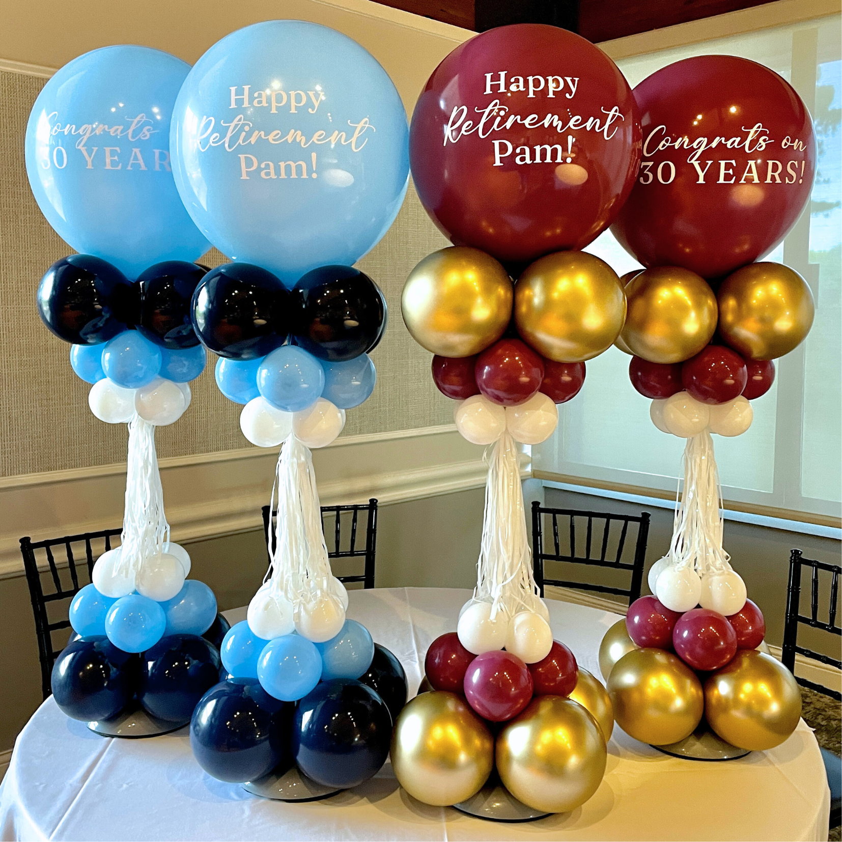 Balloon arrangements celebrating retirement and 30 years, featuring blue and burgundy balloons with white lettering and gold elements.