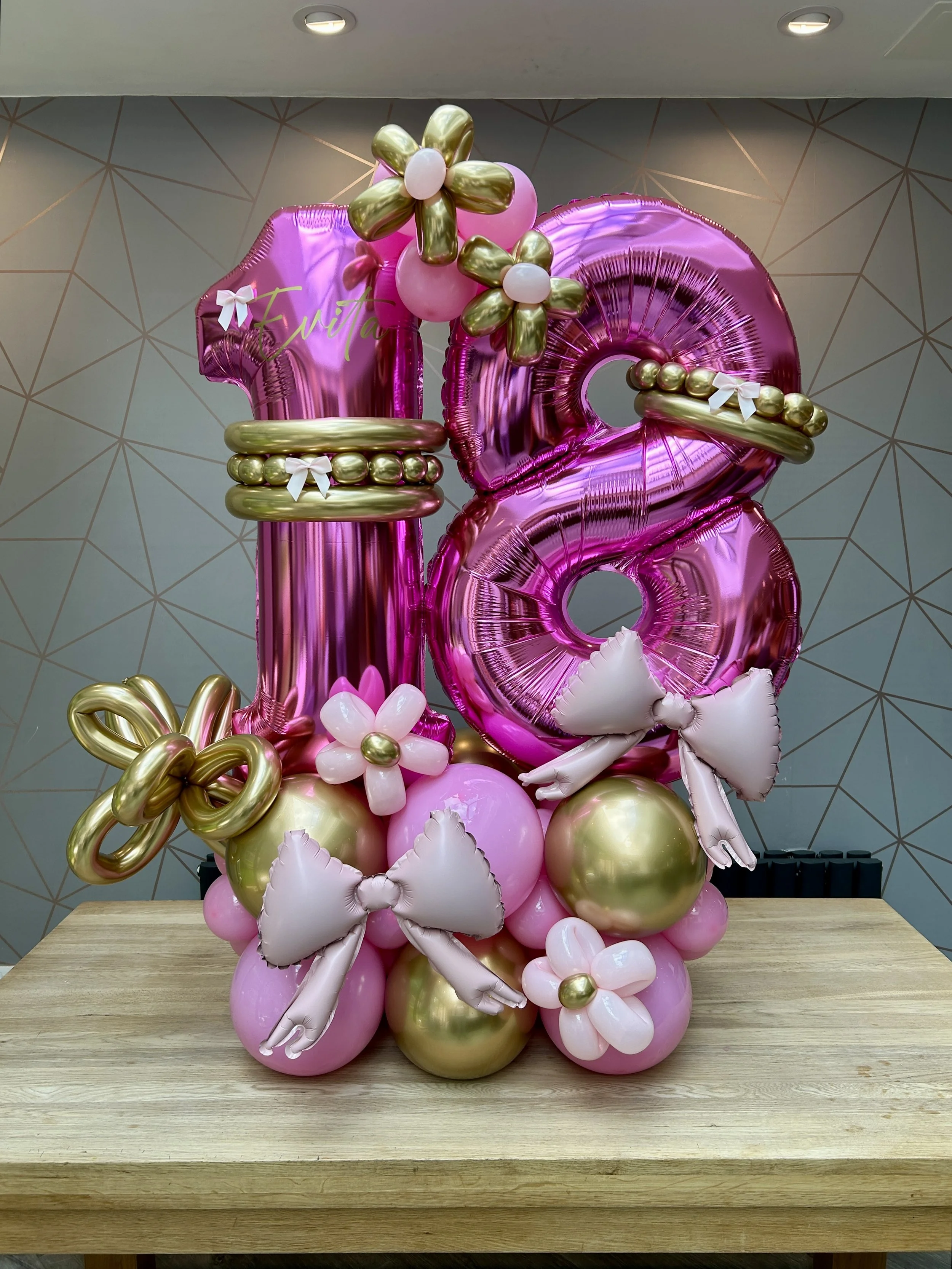 18th birthday stack with pink and gold balloons