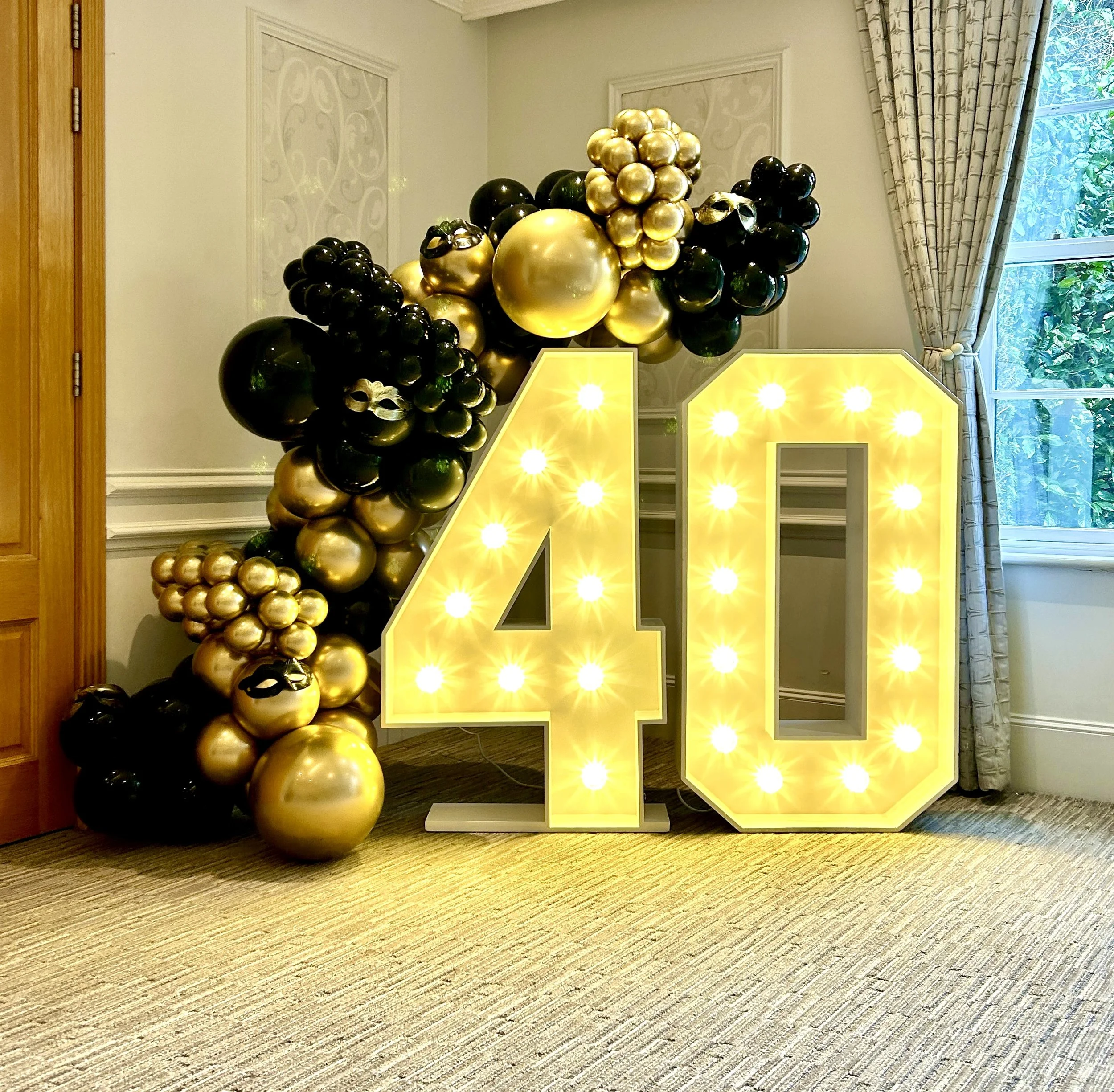 light up 40 with black and gold balloons at alexander house hotel