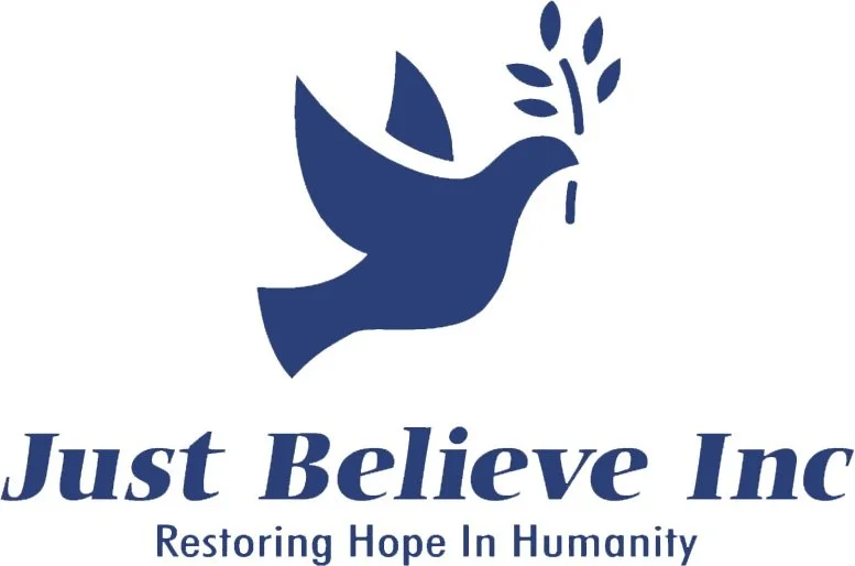 Logo featuring a blue dove carrying an olive branch with the text "Just Believe Inc. Restoring Hope In Humanity" underneath.
