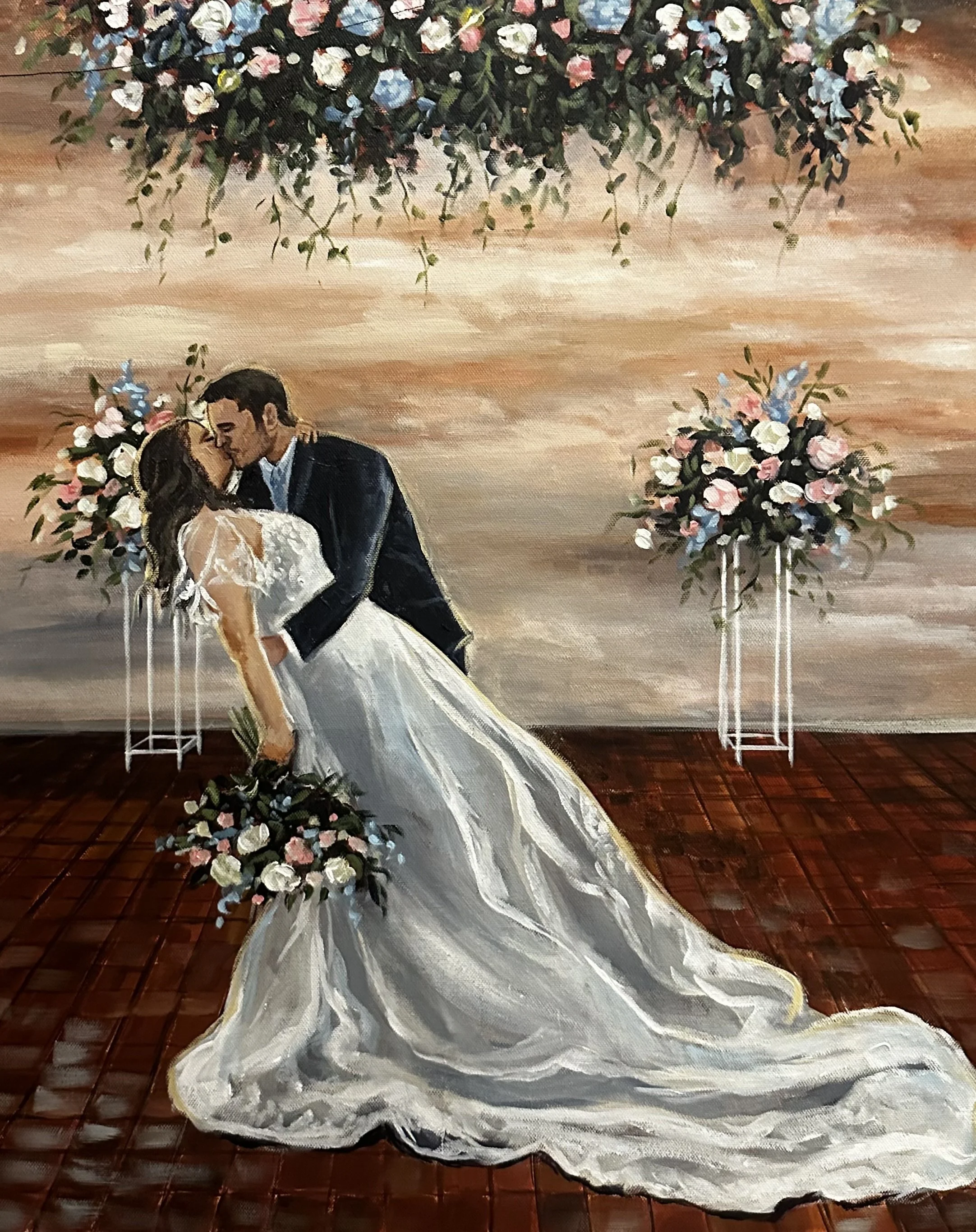Painting of a bride and groom sharing a kiss during their wedding dance, with floral arrangements and a sunset-like background.