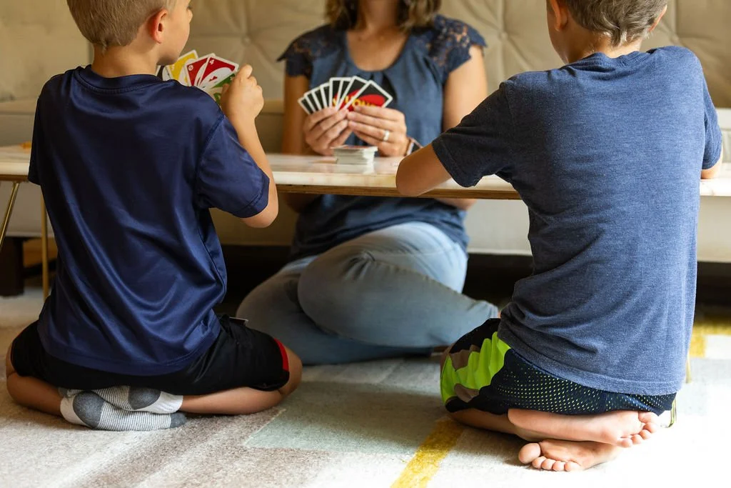 joyful mom playing with her kids