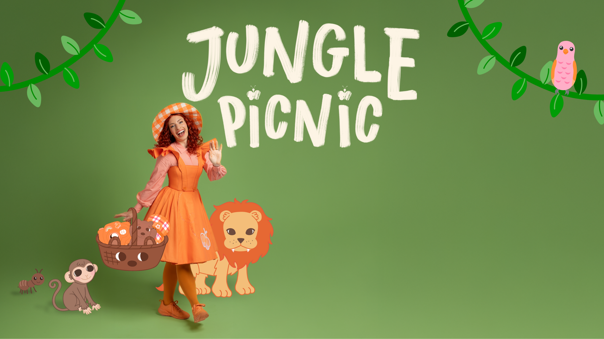 A woman with curly red hair in a bright orange dress and matching hat, holding a basket of cartoon animals, standing against a green jungle-themed background with the text 'Jungle Picnic' and cartoon animals such as a lion, monkey, and ant, and decorative vines and bird illustrations.