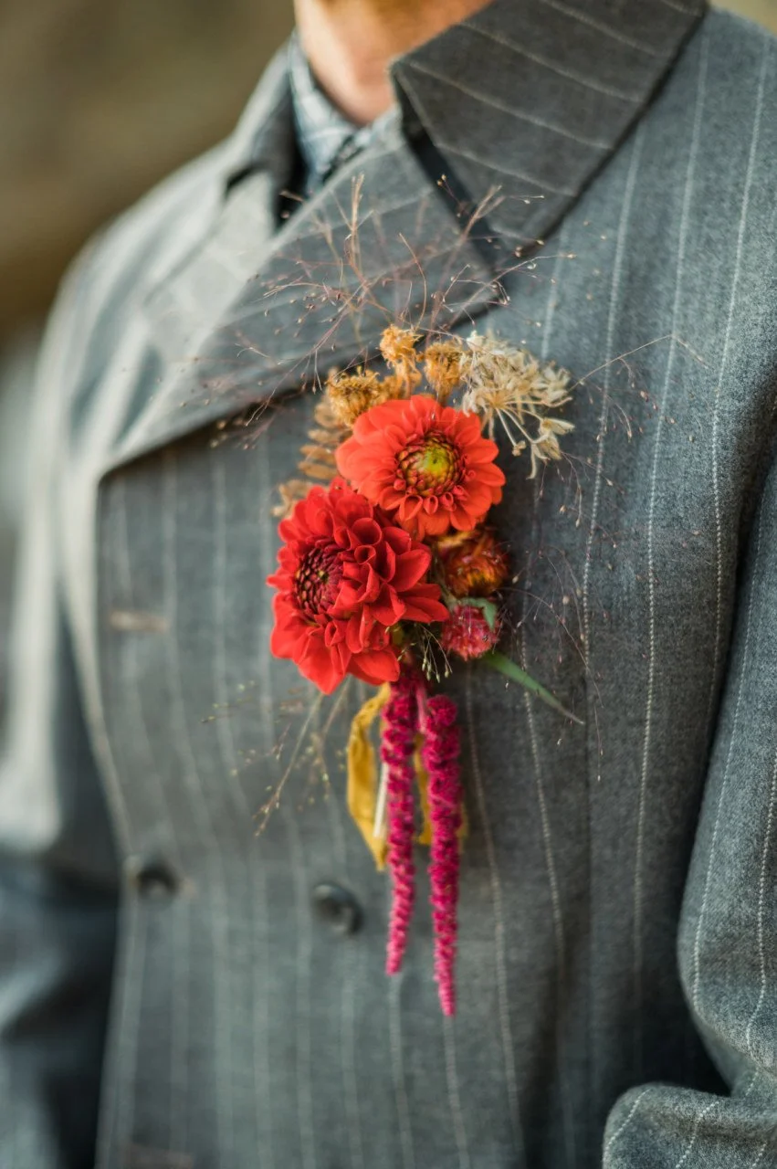 Boutonniere of red farm flowers dain Bellingham
