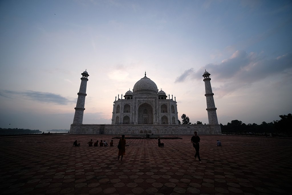 The sky lightening behind the Taj Mahal