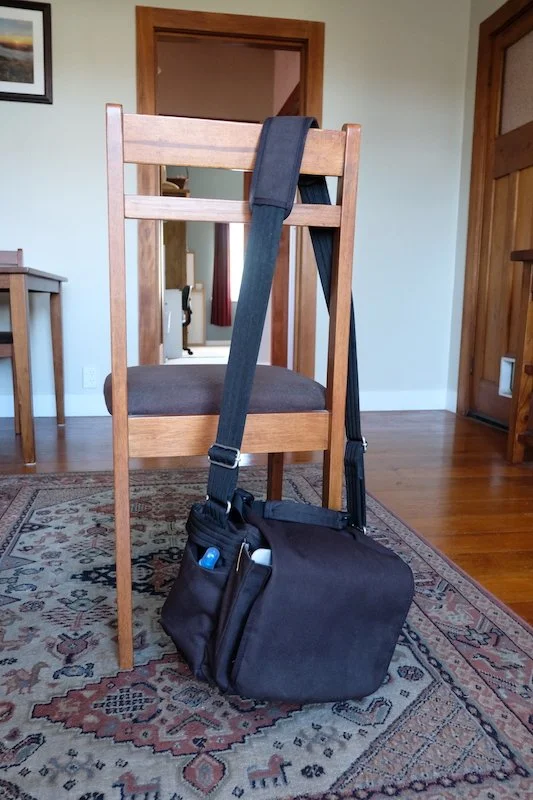 Bag hanging on chair for scale