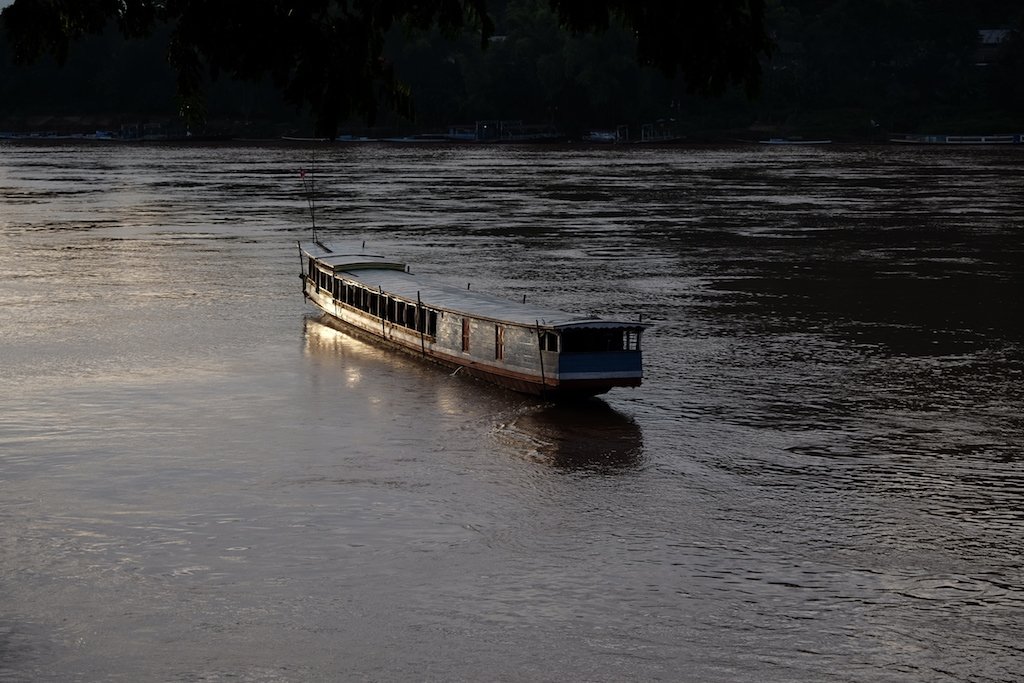 Slow boat on the Mekong at sunset