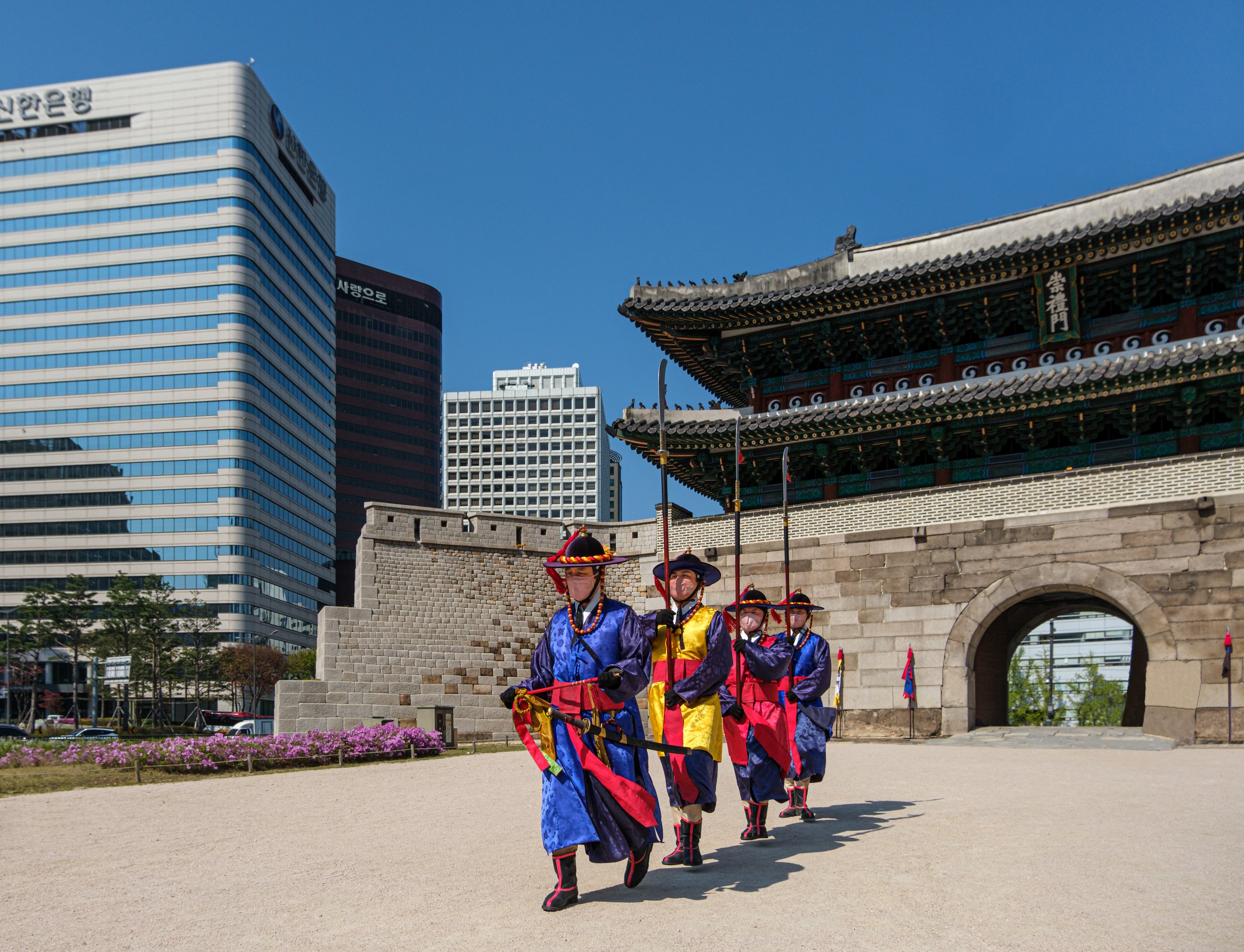 "Old Meets New", guards at Sungnyenum gate