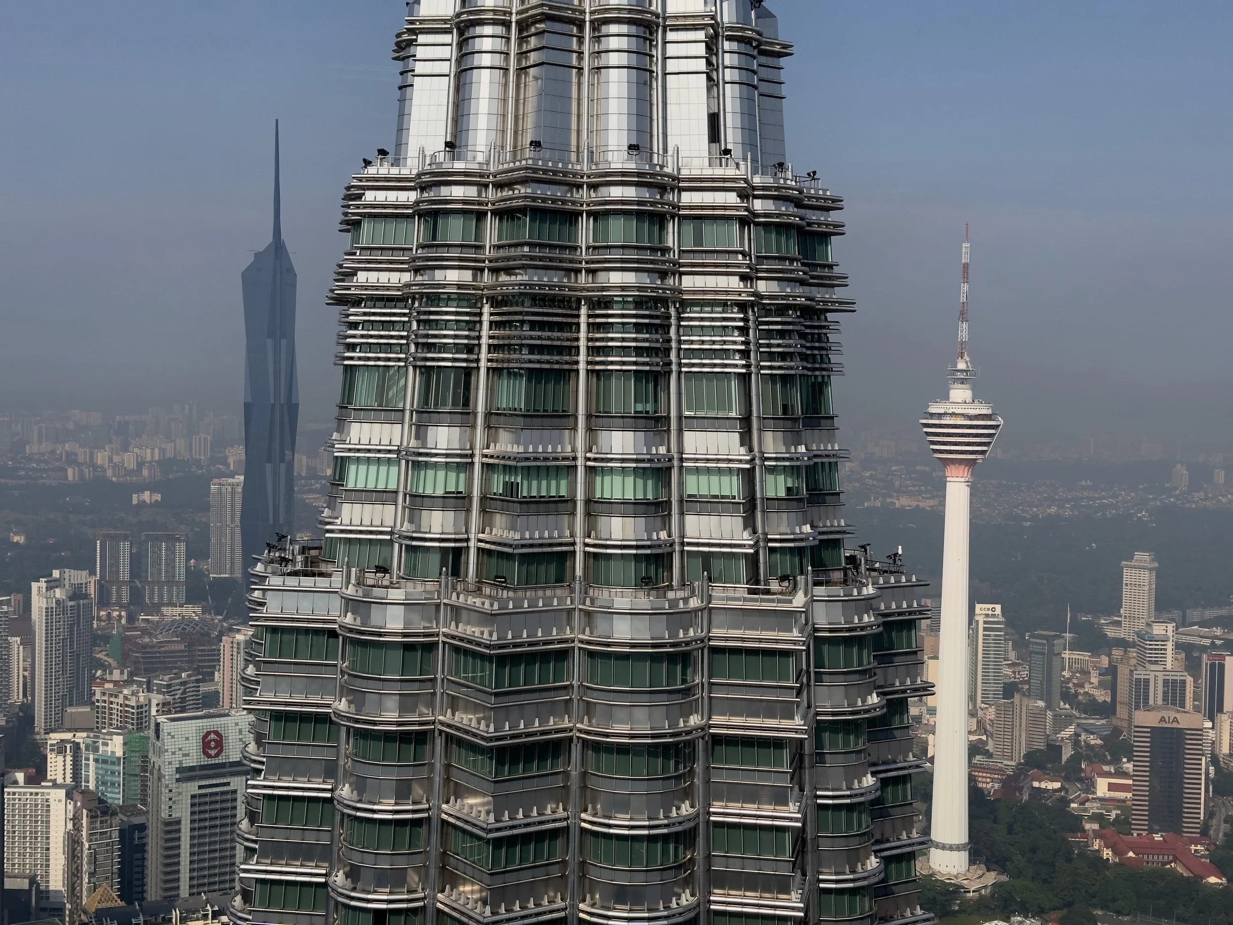 Tower 1, Petronas Towers, with Merdaka 118 ( left ) and Menara Kuala Lumpur ( right )