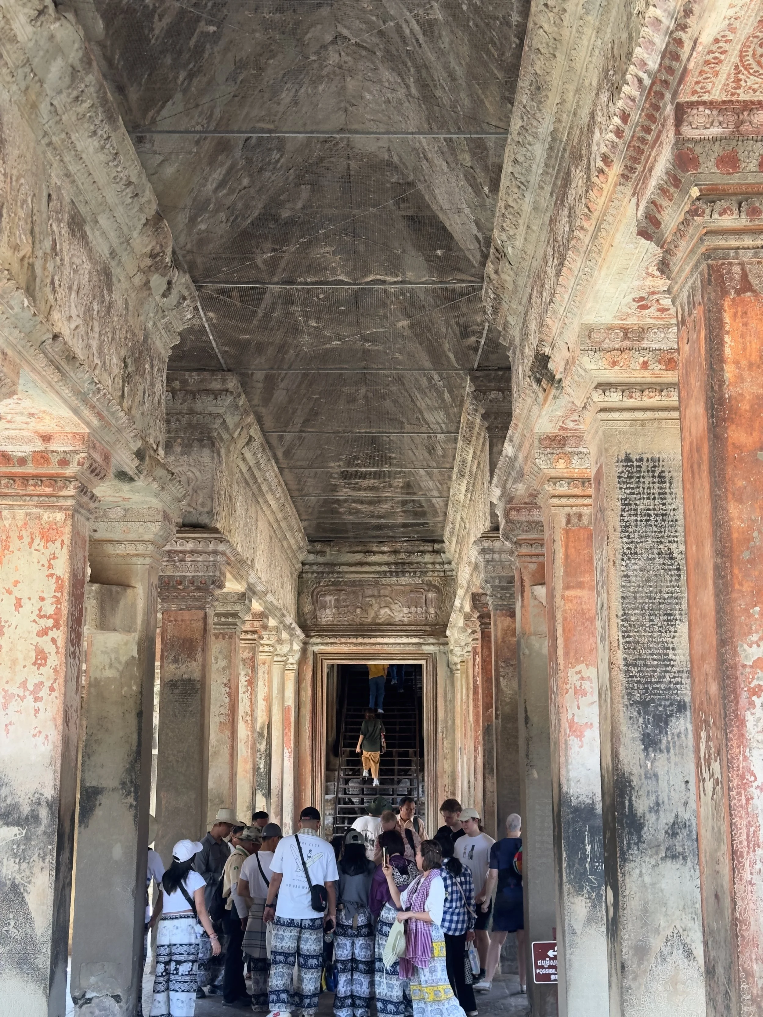 Inside the main building, Angkor Wat ( look at the elephant pants on those tourists! )