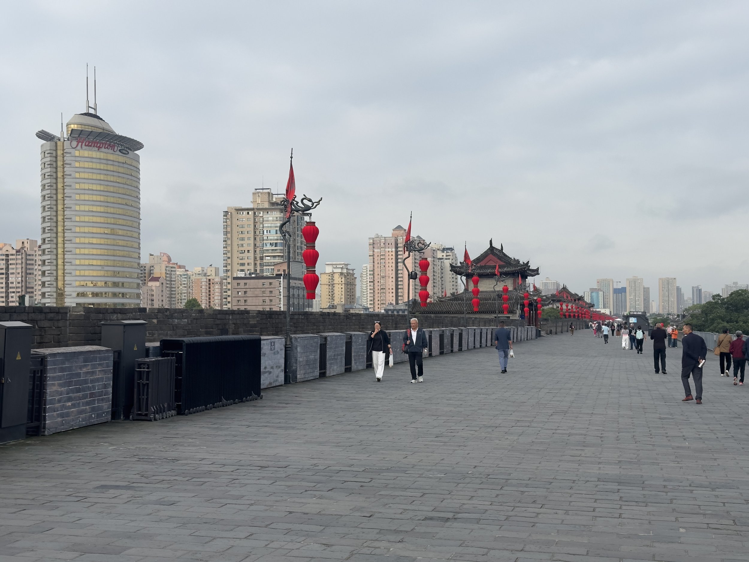 On top of the wall,  with lanterns and towers