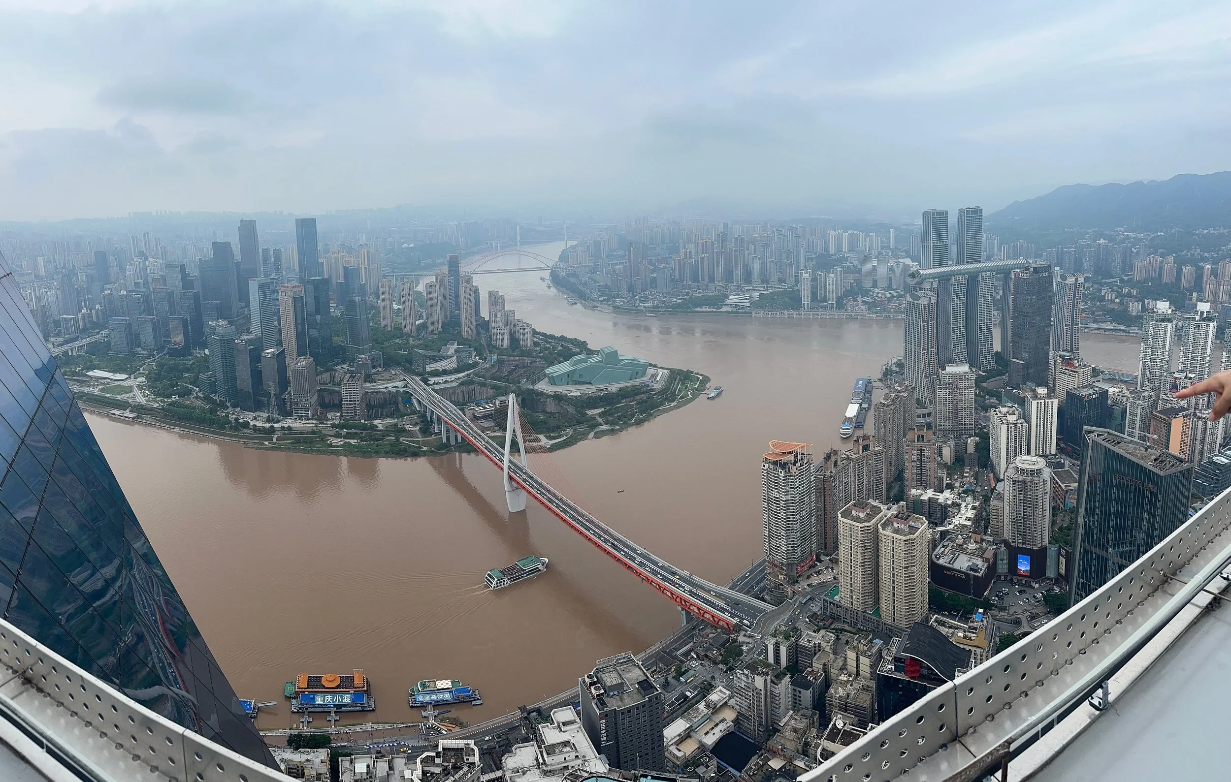 Qiansimen Bridge and the junction of Jialing ( from the left ) and Yangtze ( from right and into the distance ) Rivers