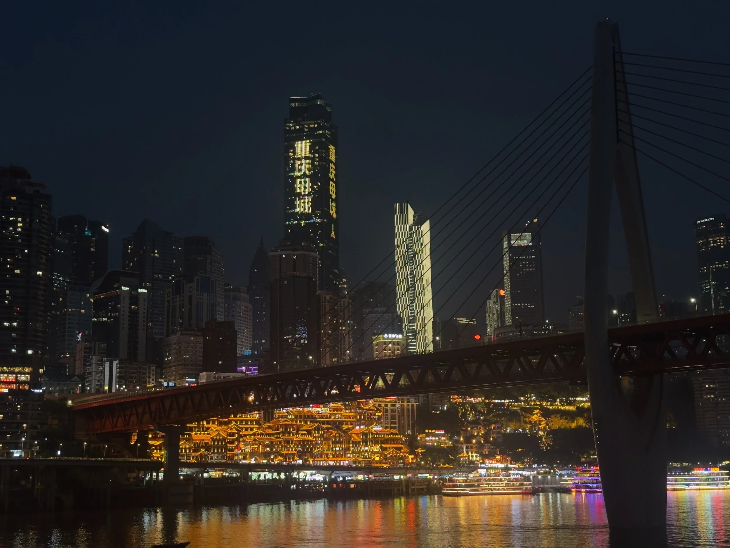 Qiansimen Bridge, with Jiefangbei skyline beyond ( Hongyadong is lit up under the bridge )