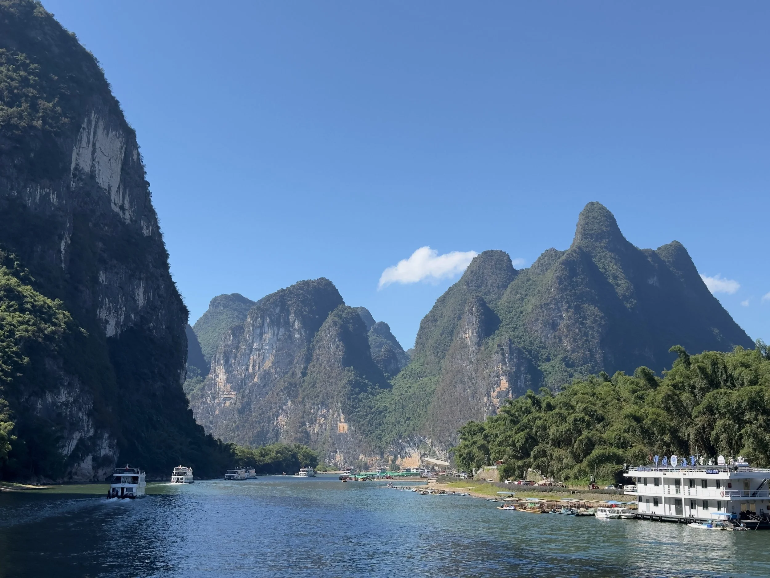 A village to the right with a floating boat club