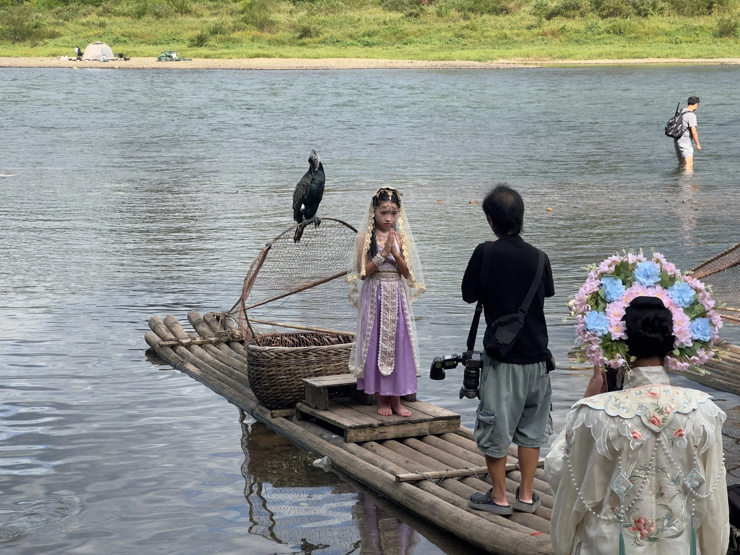 Girl and raft and cormorant