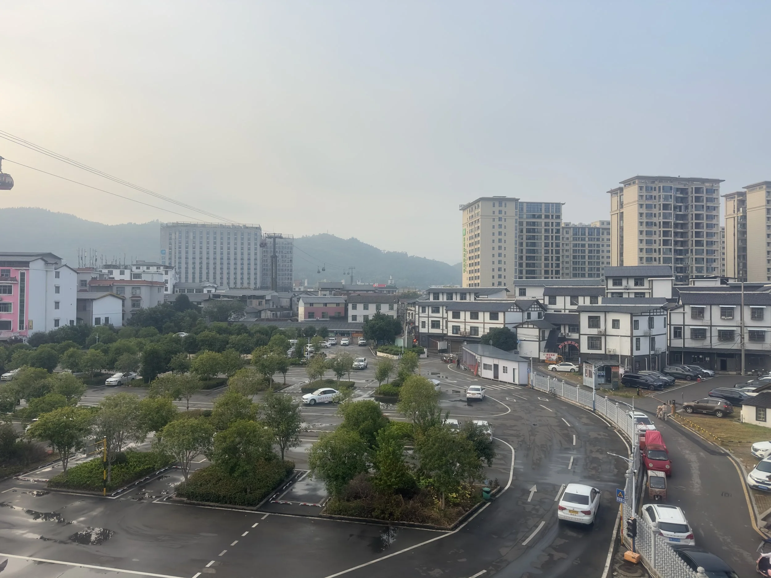 The view from our hotel of a car training school and the cable car up Tianmen Mountain