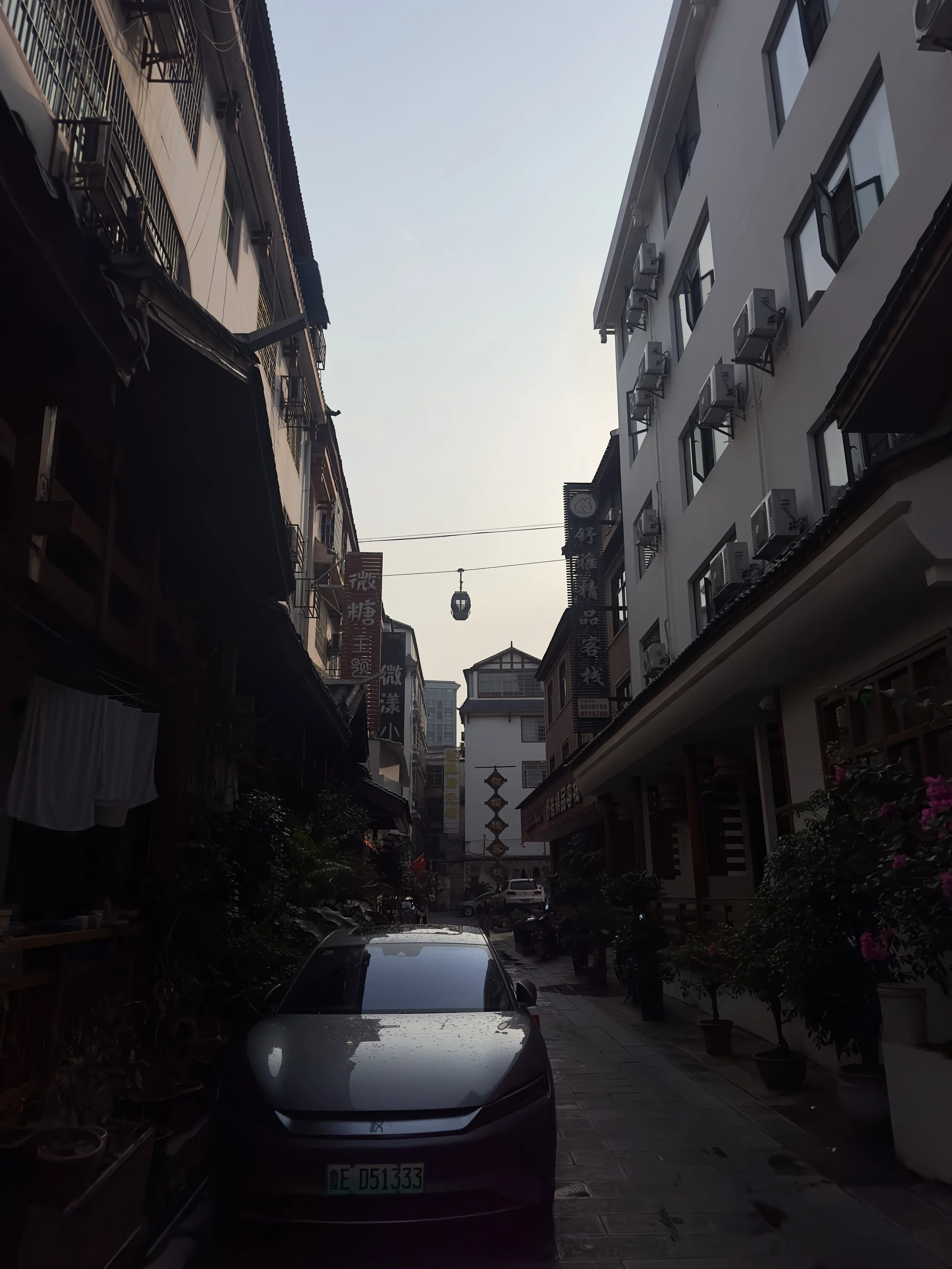 The cable car crossing one of the alleys near the hotel
