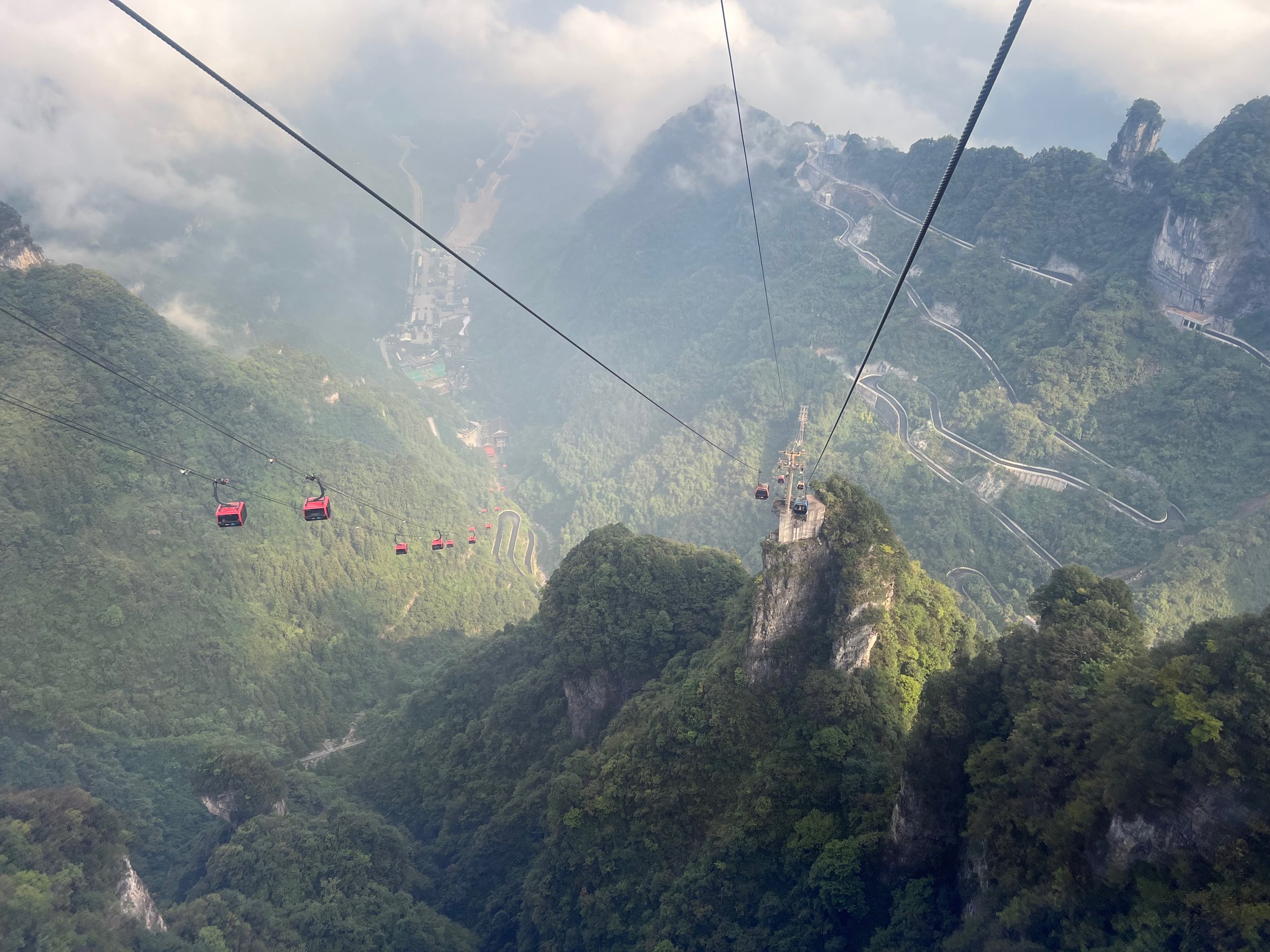 2 cable cars and a windy road