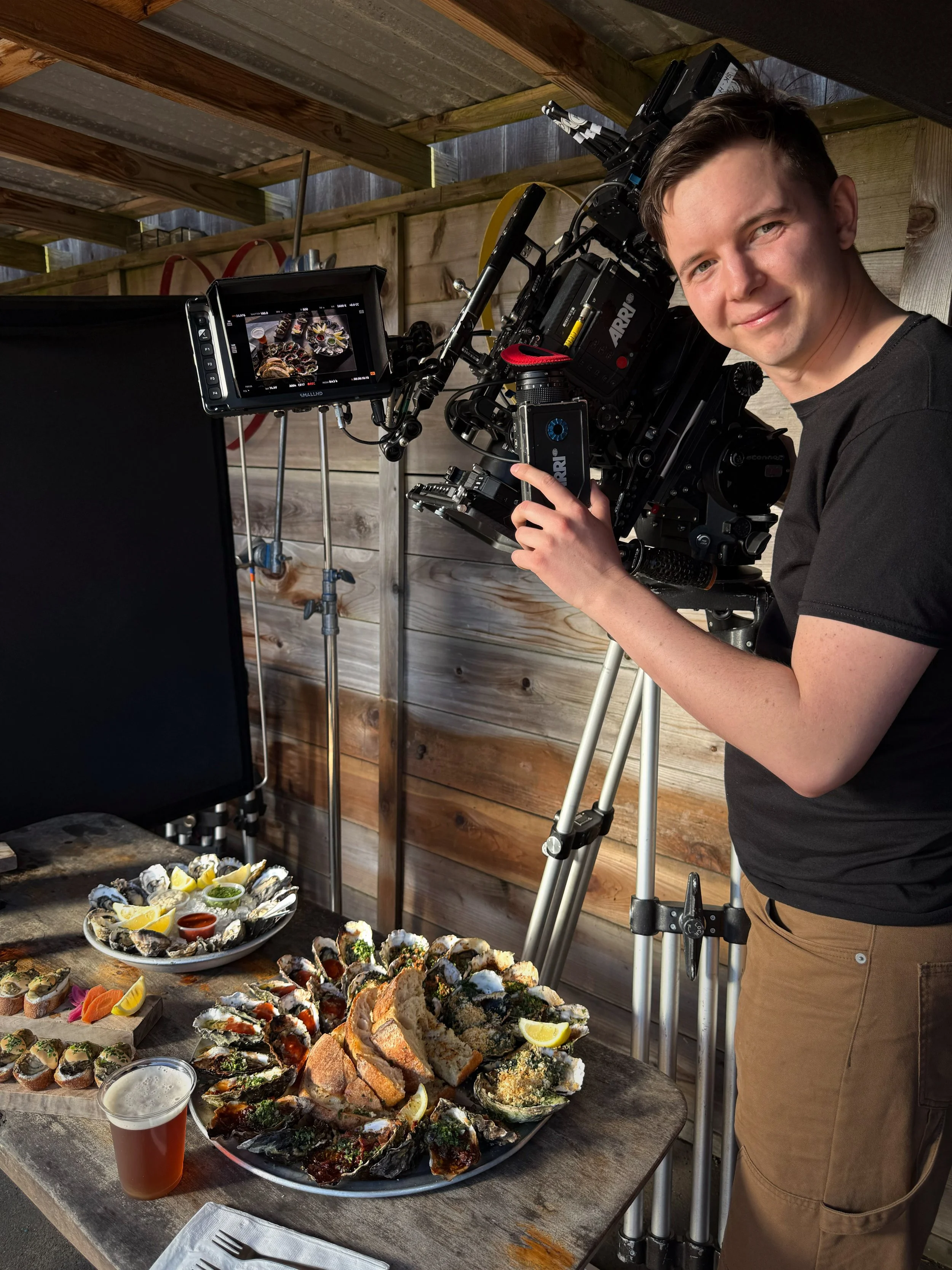 Cinematographer Ethan Swope films an assortment of oysters at The Marshall Store in Inverness for a Marin Tourism video production.