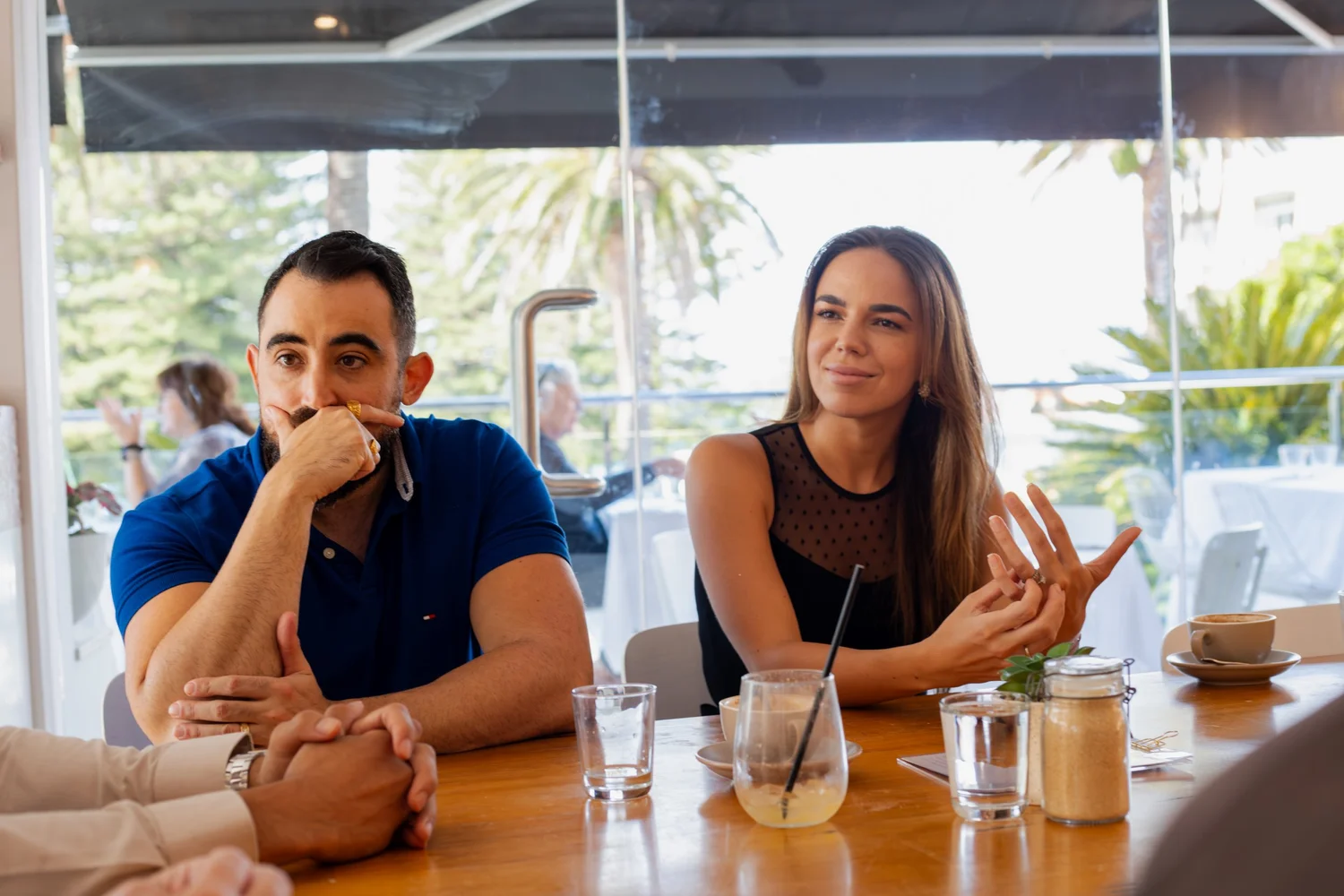 Nick and Paige from My Support Co. meeting with a participant at a local cafe
