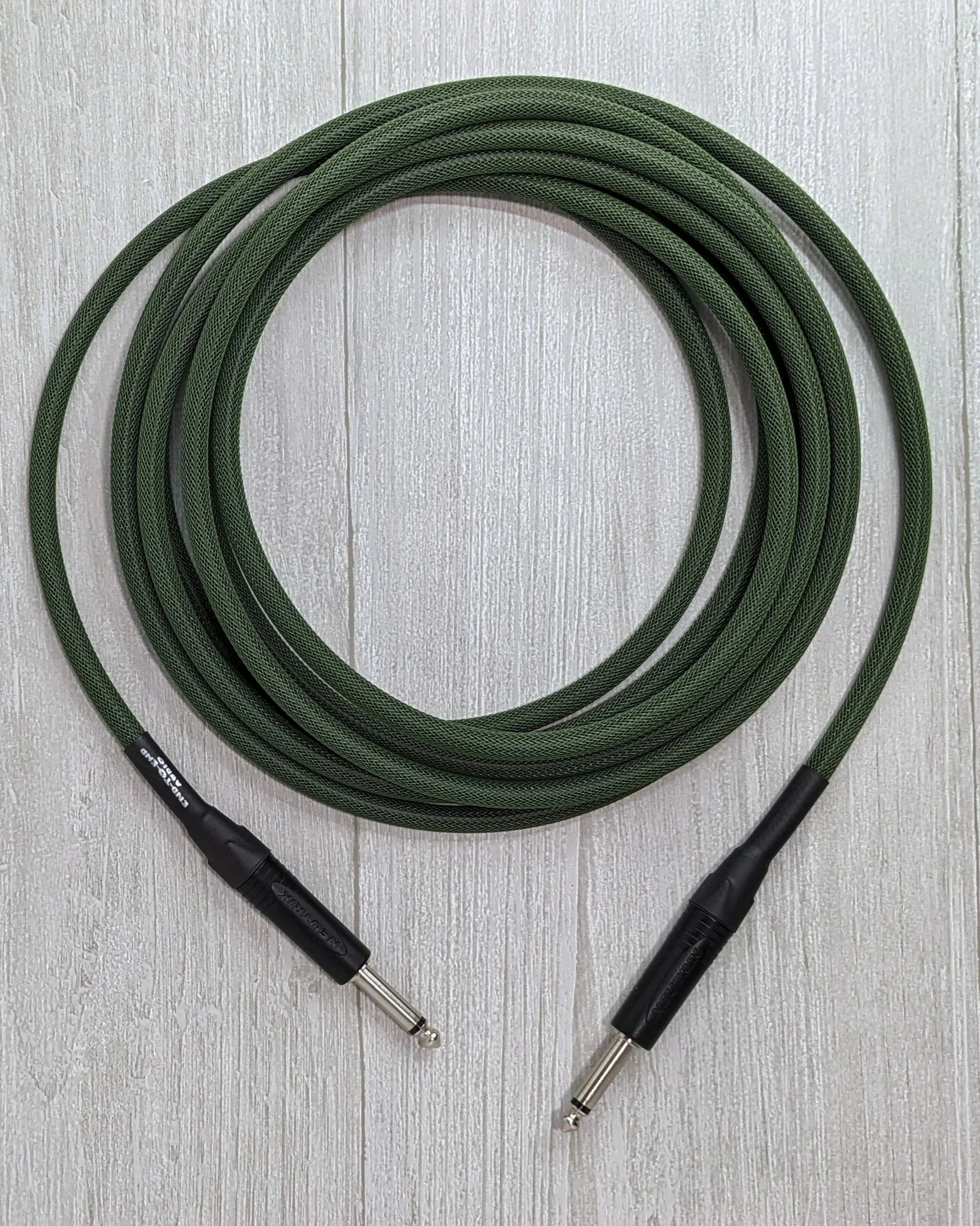               1/4" Unbalanced Speaker Cable; Neutrik 1/4" TS Plugs, MOgami W3082 Sppeaker Cable, Techflex Sleeve