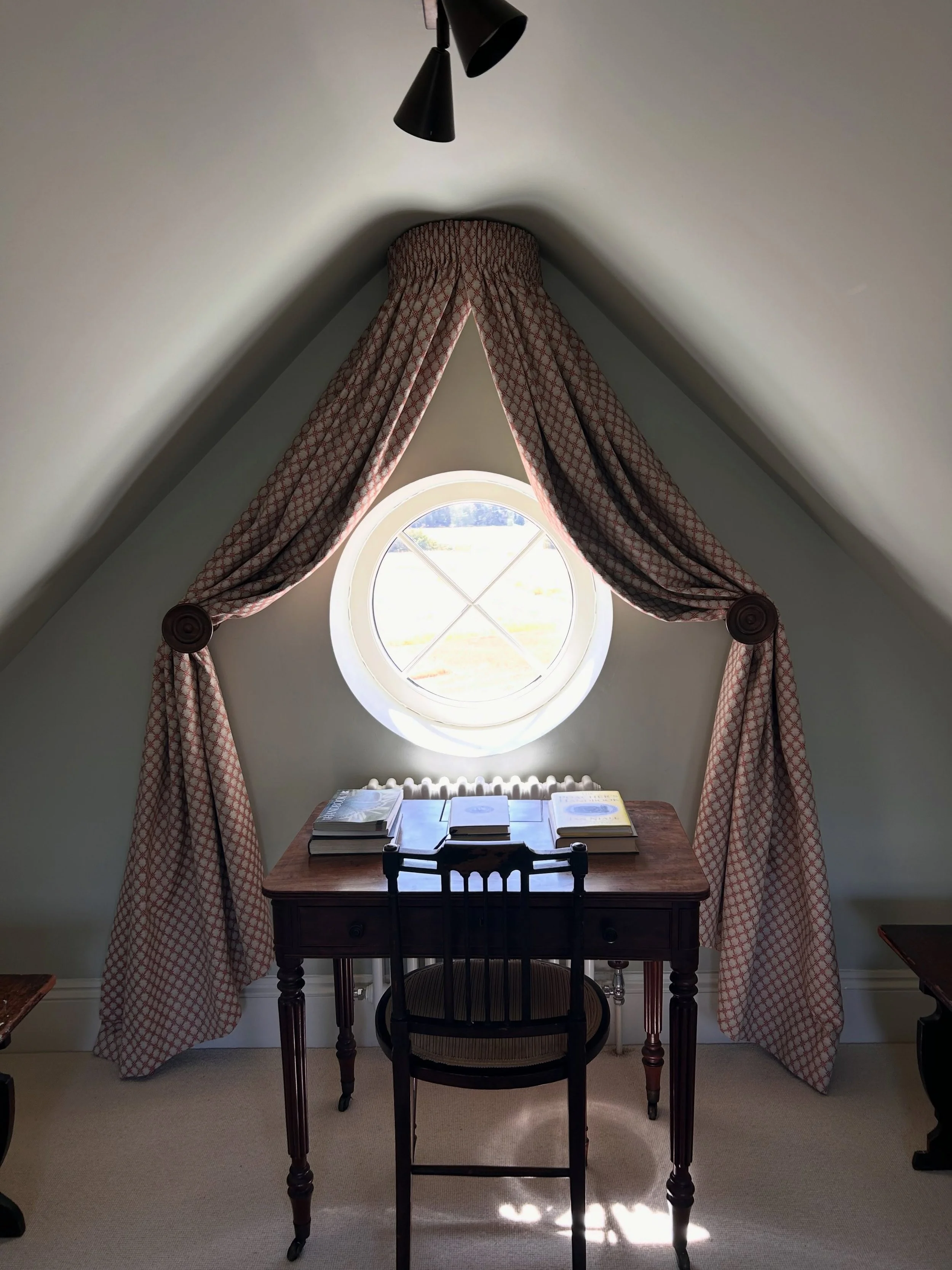 When we were asked to dress this round window at our client&rsquo;s home in Northamptonshire, we sketched out a few ideas before landing on a coronet with curtains: pretty enough to frame the window, practical enough to close fully when needed.

Swip