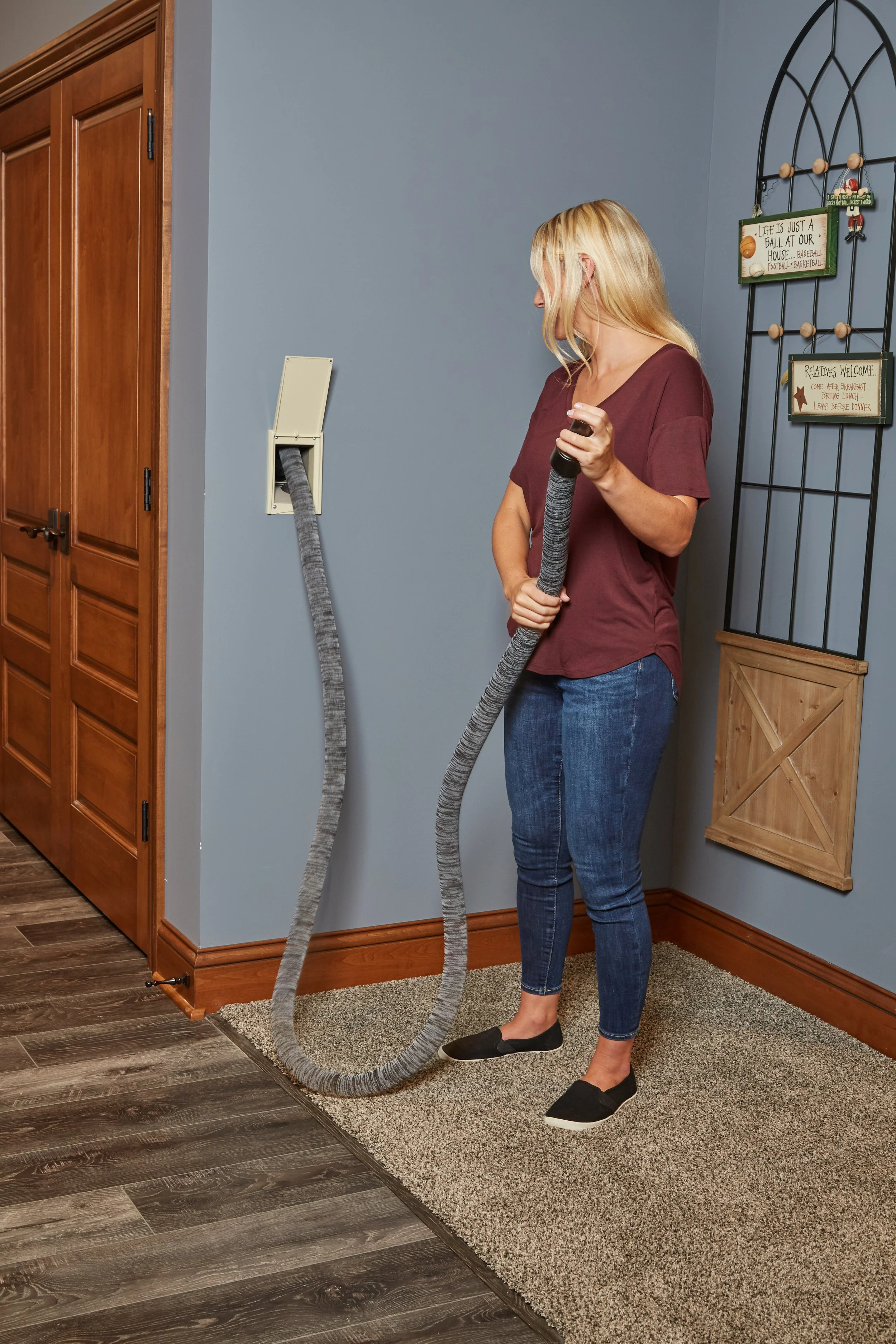Retractable central vacuum hose system