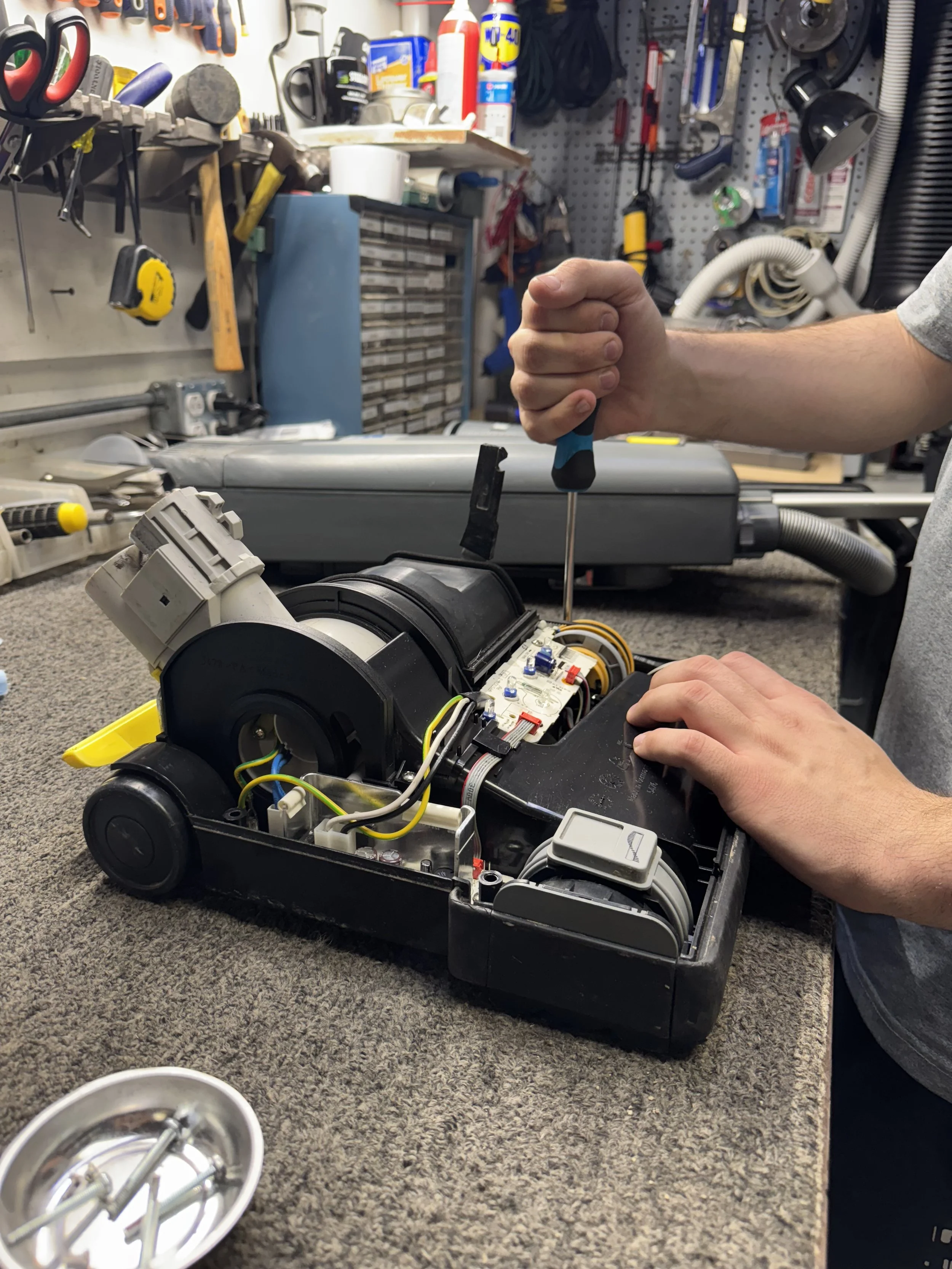 Vacuum cleaner being professionally repaired at the Central Vacuum service bench