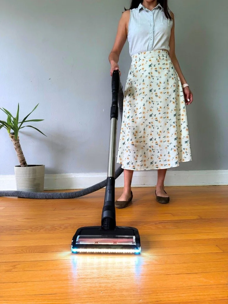 Using a retractable central vacuum hose with cleaning wand