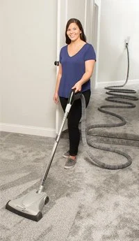 Vacuuming with retractable hose