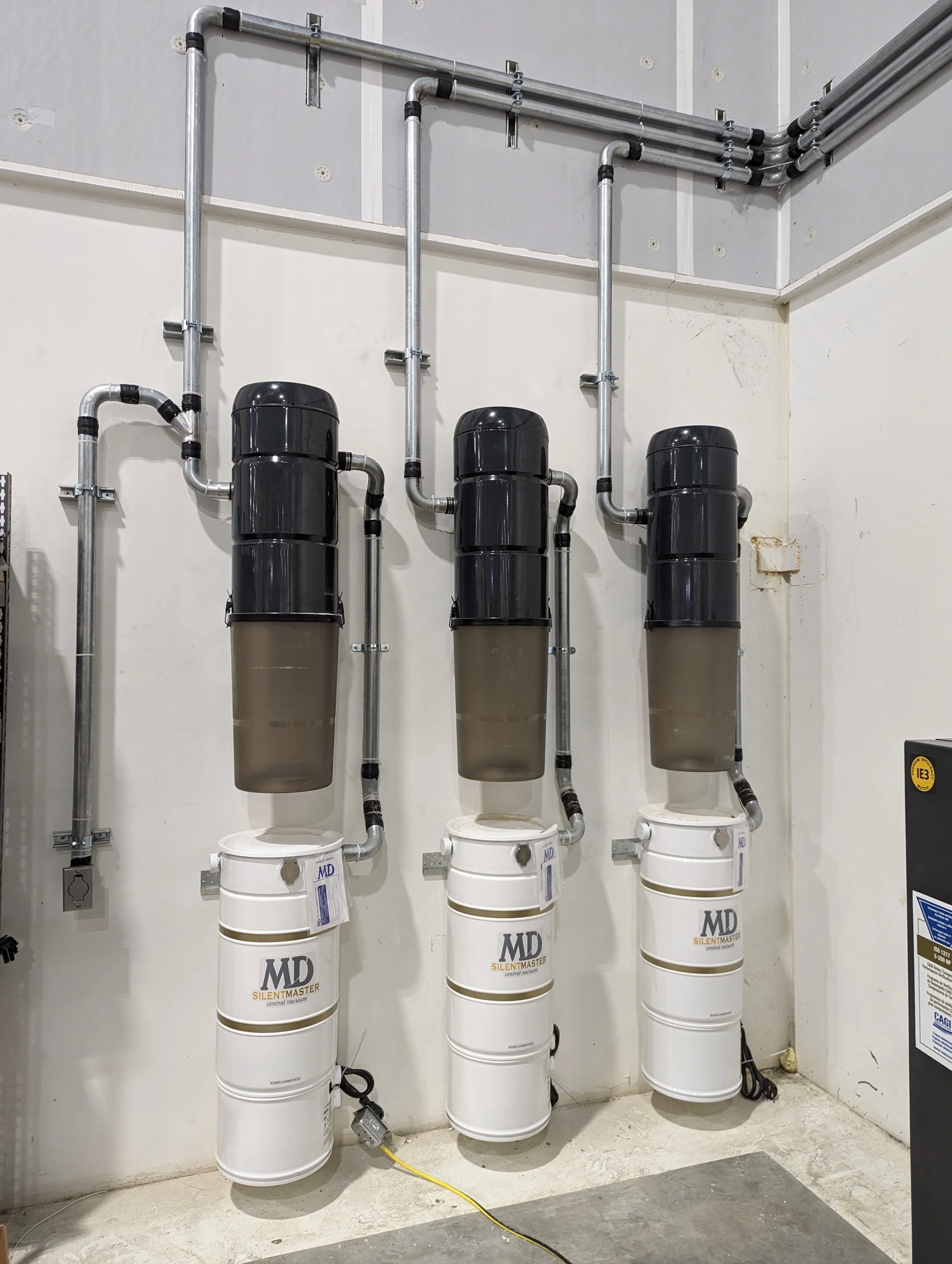 Three-unit commercial central vacuum installation