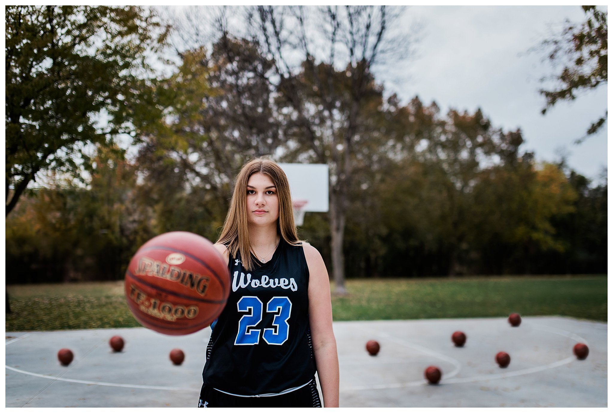 Basketball player posing with ball Stock Photo - Alamy