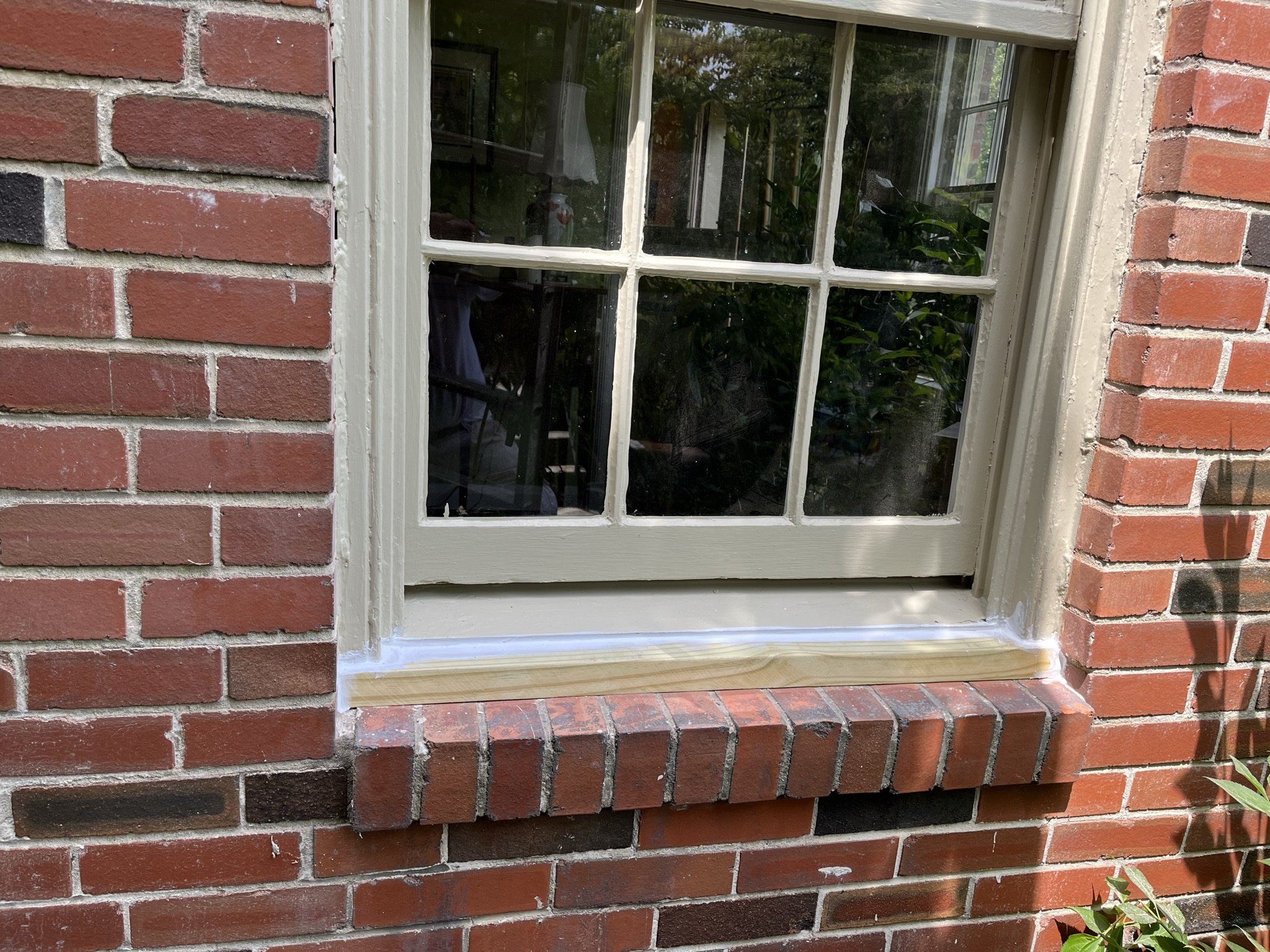 Outer window sill replaced with pressure-treated lumber