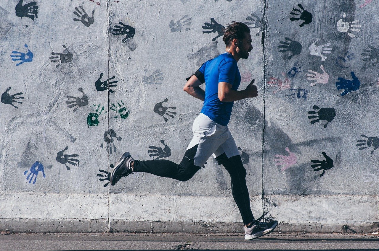 guy running with hands on wall behind him.jpg