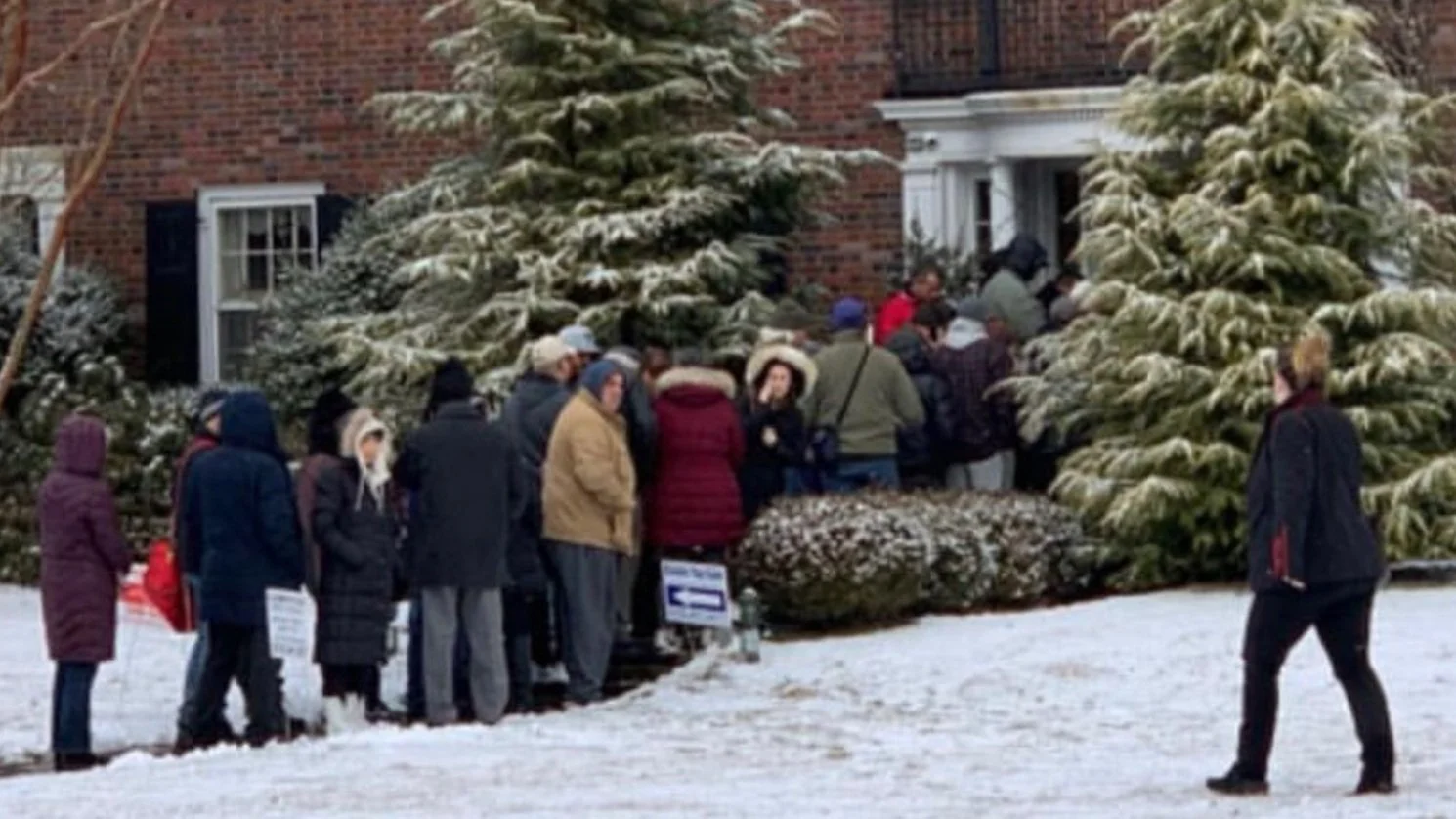 Shoppers lined up outside an All American Tag Sales event