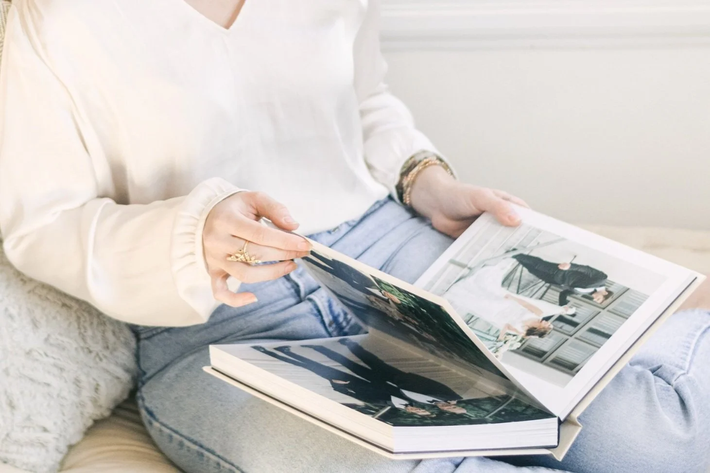 Turning pages of a luxury wedding photo album