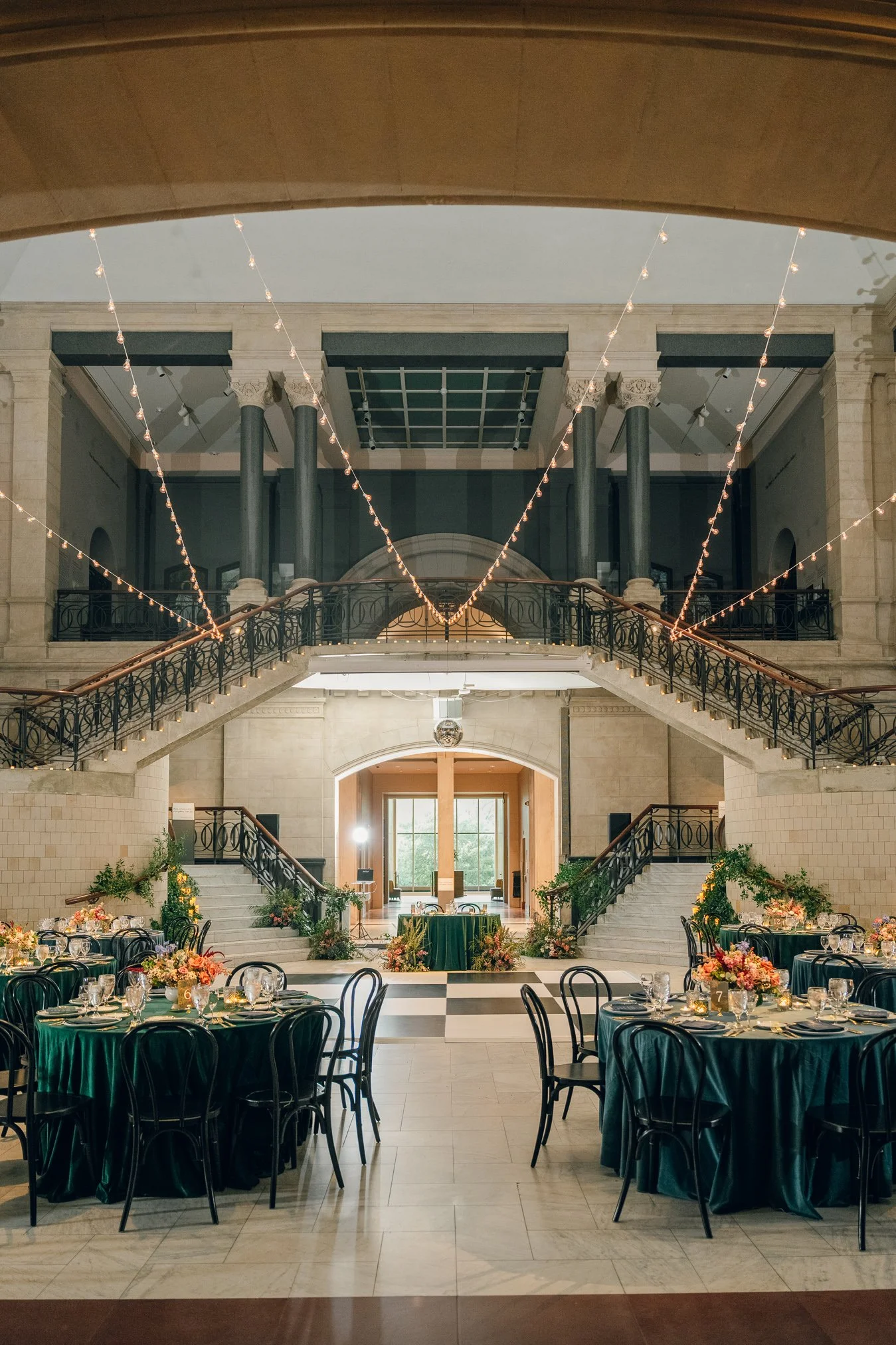 Elegant wedding reception decor inside the Cincinnati Art Museum