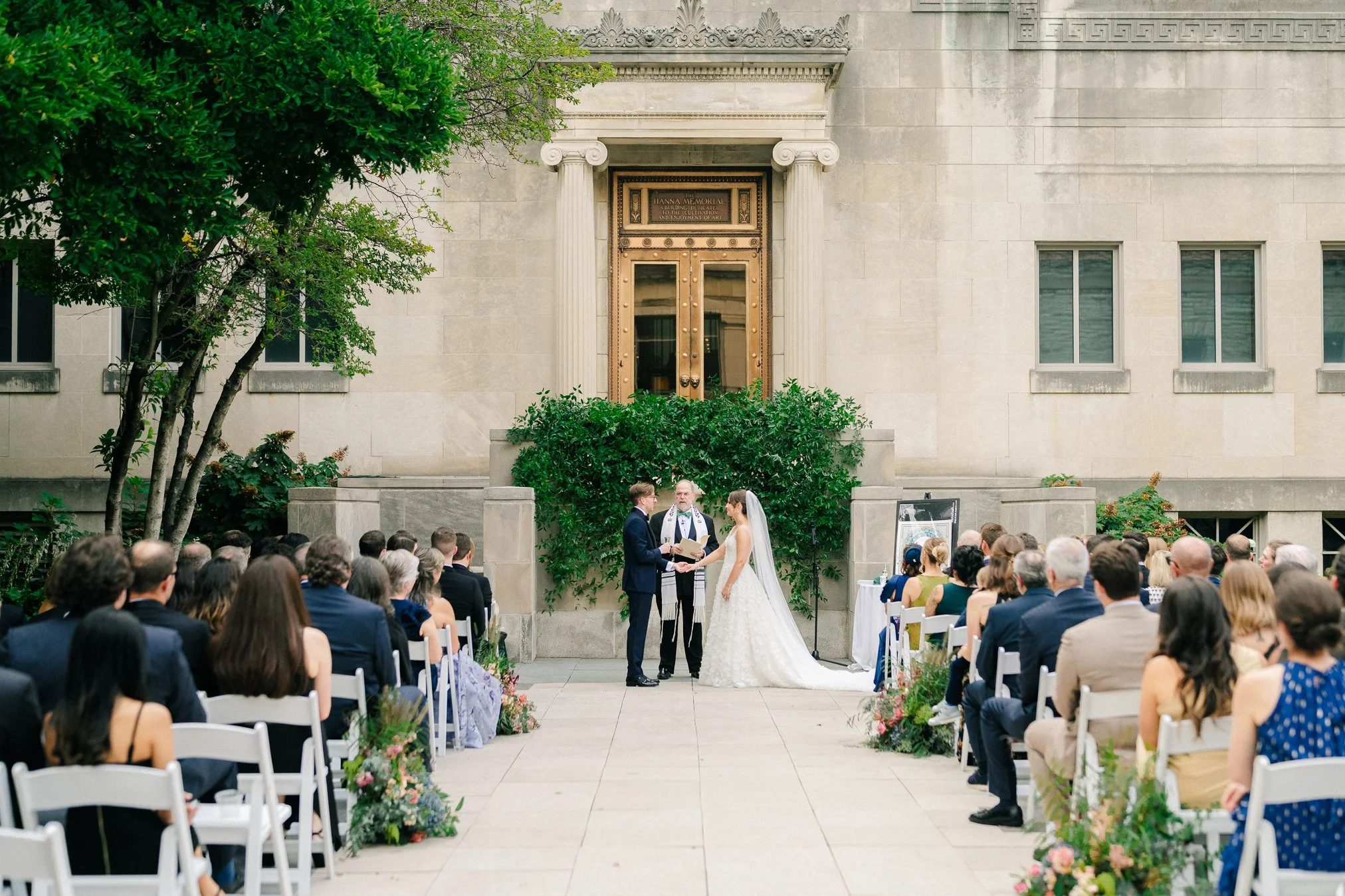 An outdoor wedding ceremony in the courtyard of the Cincinnati Art Museum